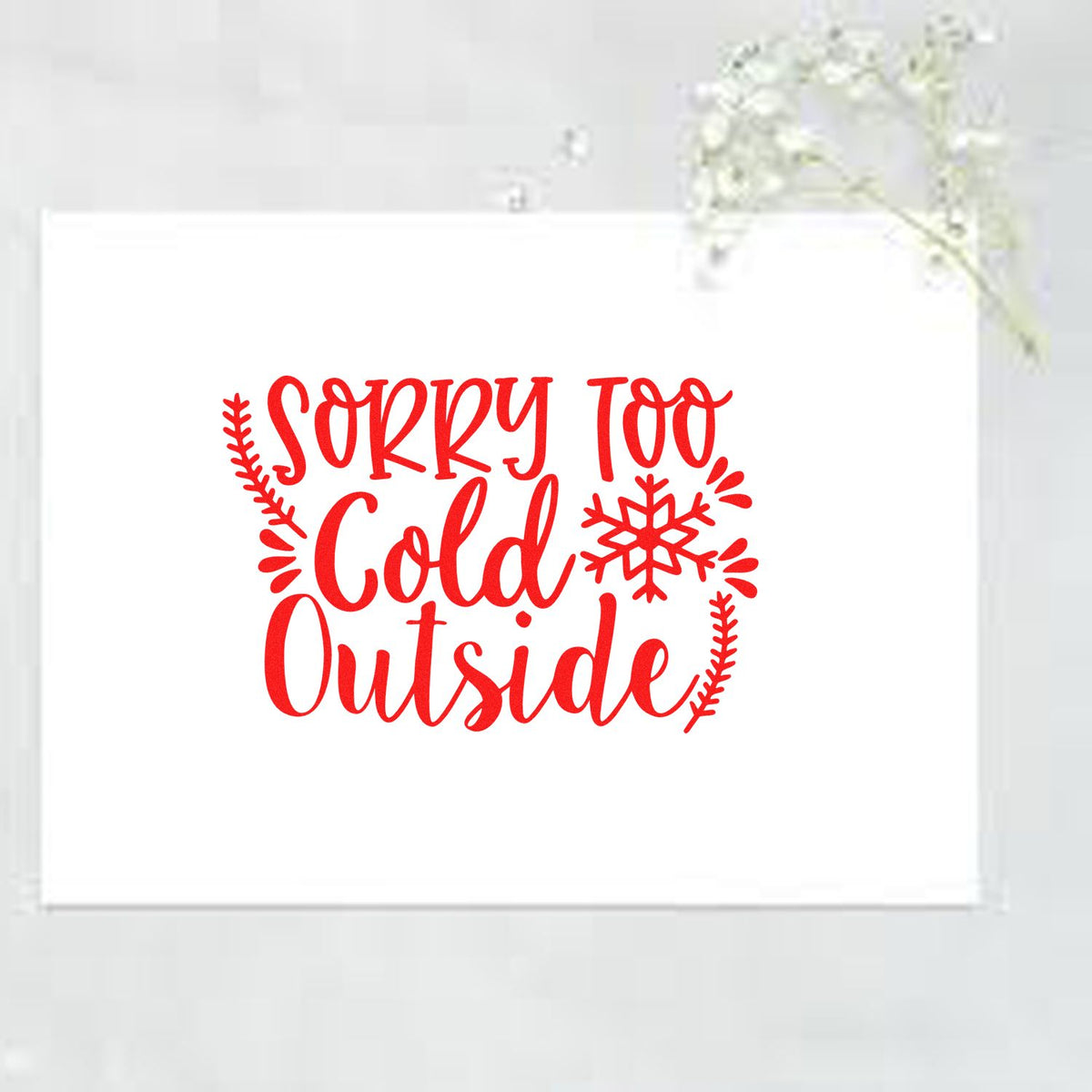 Red custom stamp seal reading Sorry Too Cold Outside with snowflake and winter branches on a white card.