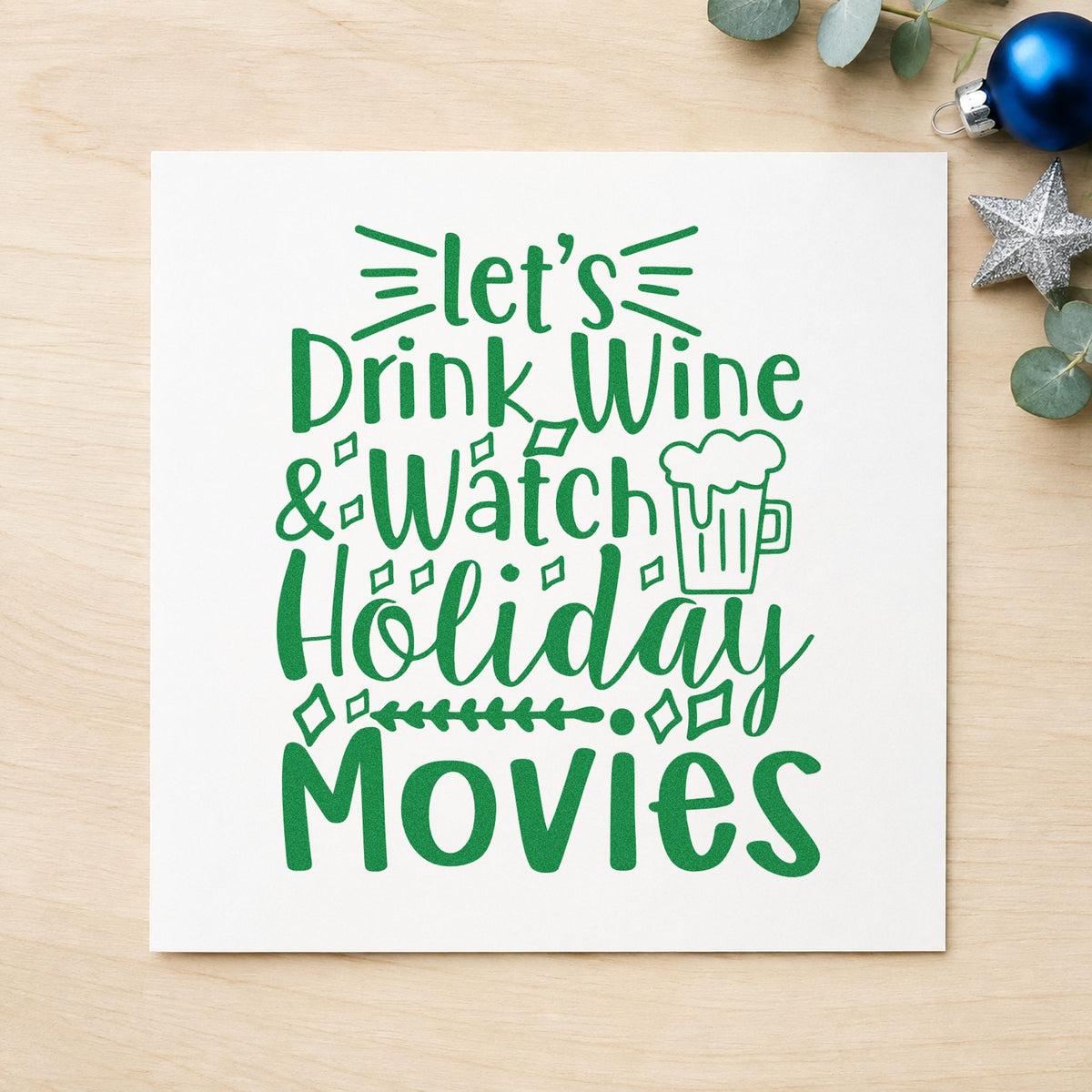 Wine And Holiday Movies craft stamp imprint in green ink on a handmade project, one idea being film night cards.
