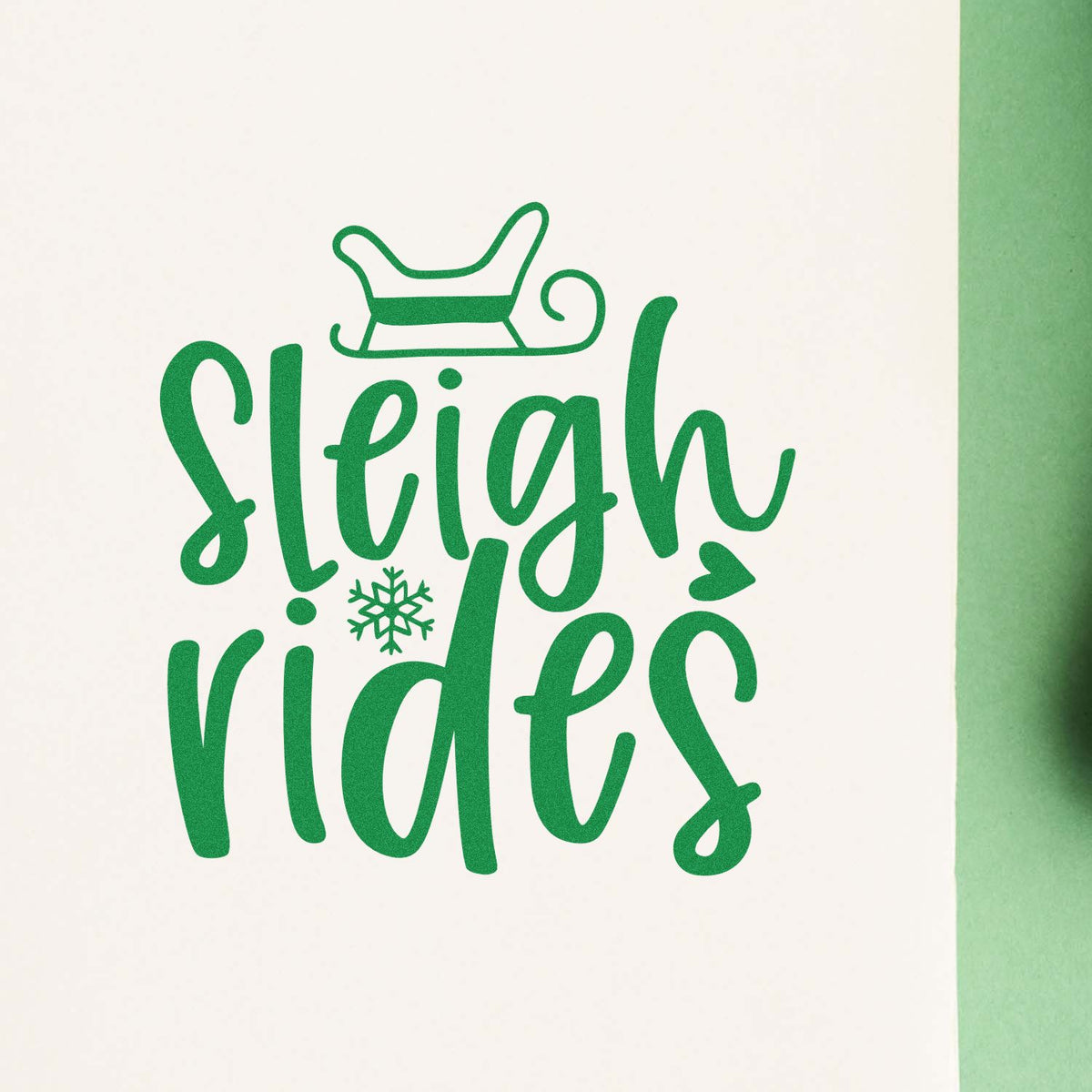 Green Sleigh Rides holiday stamp and seal design with sleigh icon and snowflake on white background.