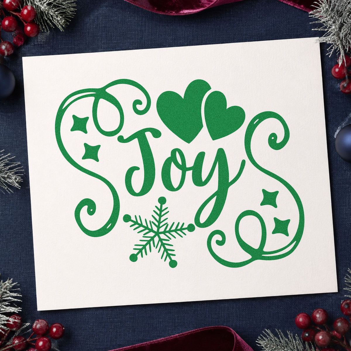 Joy Hearts Snowflake Flourish craft stamp imprint in green ink on a handmade project, one idea being heart tie gift tags.