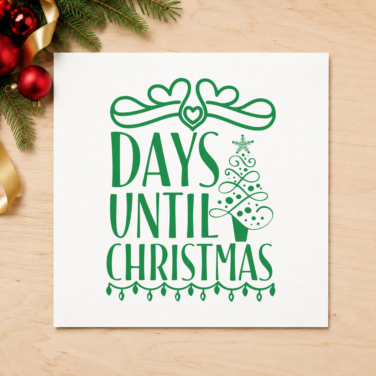 Days Until Christmas Bow craft stamp imprint in green ink on a handmade project, one idea being shop front signs.