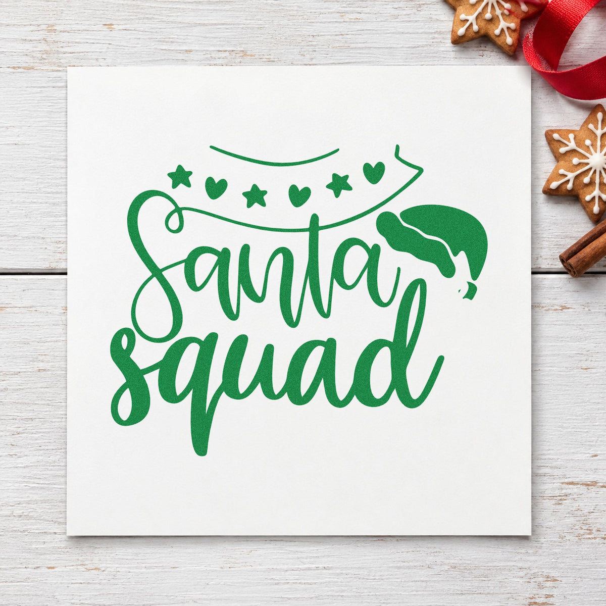 Santa Squad Heart Garland craft stamp imprinted in green ink on paper, a design suited to framed door arch.