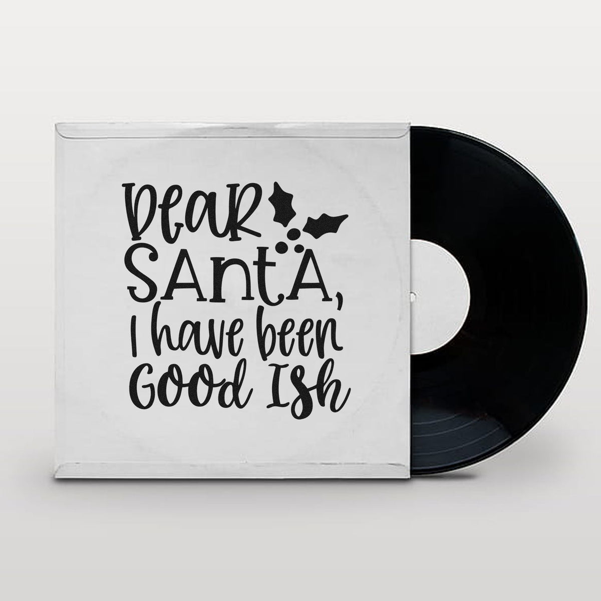 White stamp and seal product sleeve with black vinyl record and festive Dear Santa, I have been Good Ish lettering.