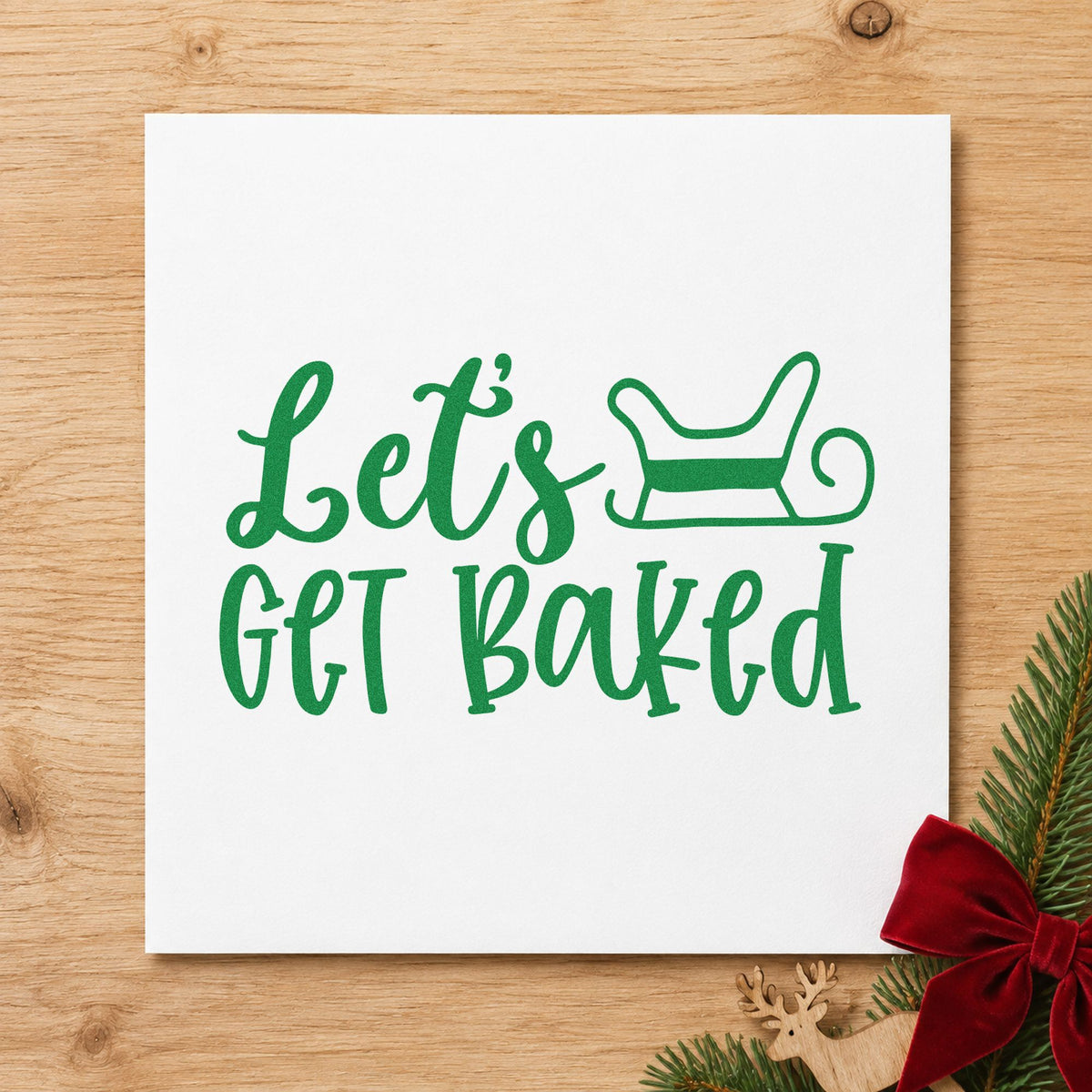 Let's Get Baked Sleigh craft stamp imprint in green ink on a handmade project, one idea being travel tin gift tags.