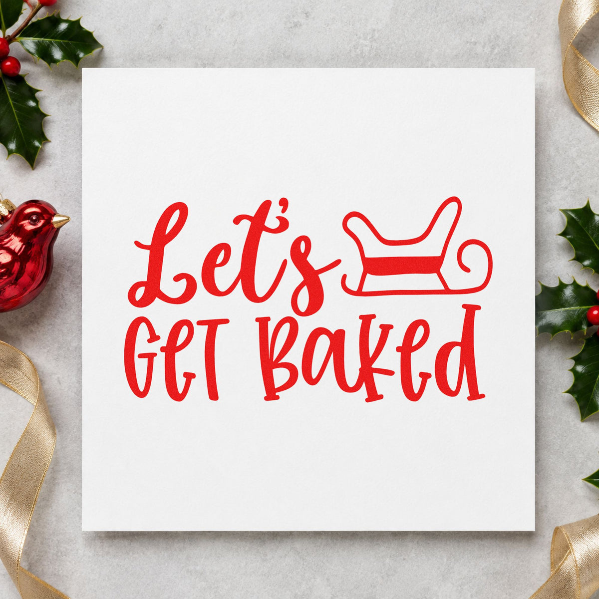 Let's Get Baked Sleigh rubber stamp shown in red ink, stamped for projects such as container lid labels.