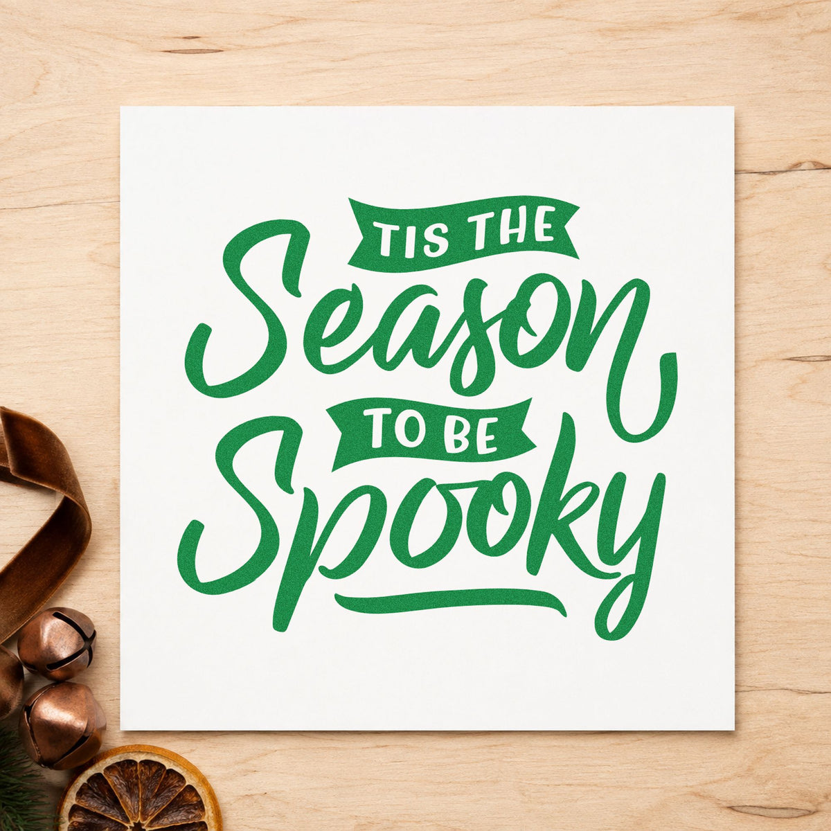 Season To Be Spooky craft stamp imprint in green ink on a handmade project, one idea being treat bag gift tags.