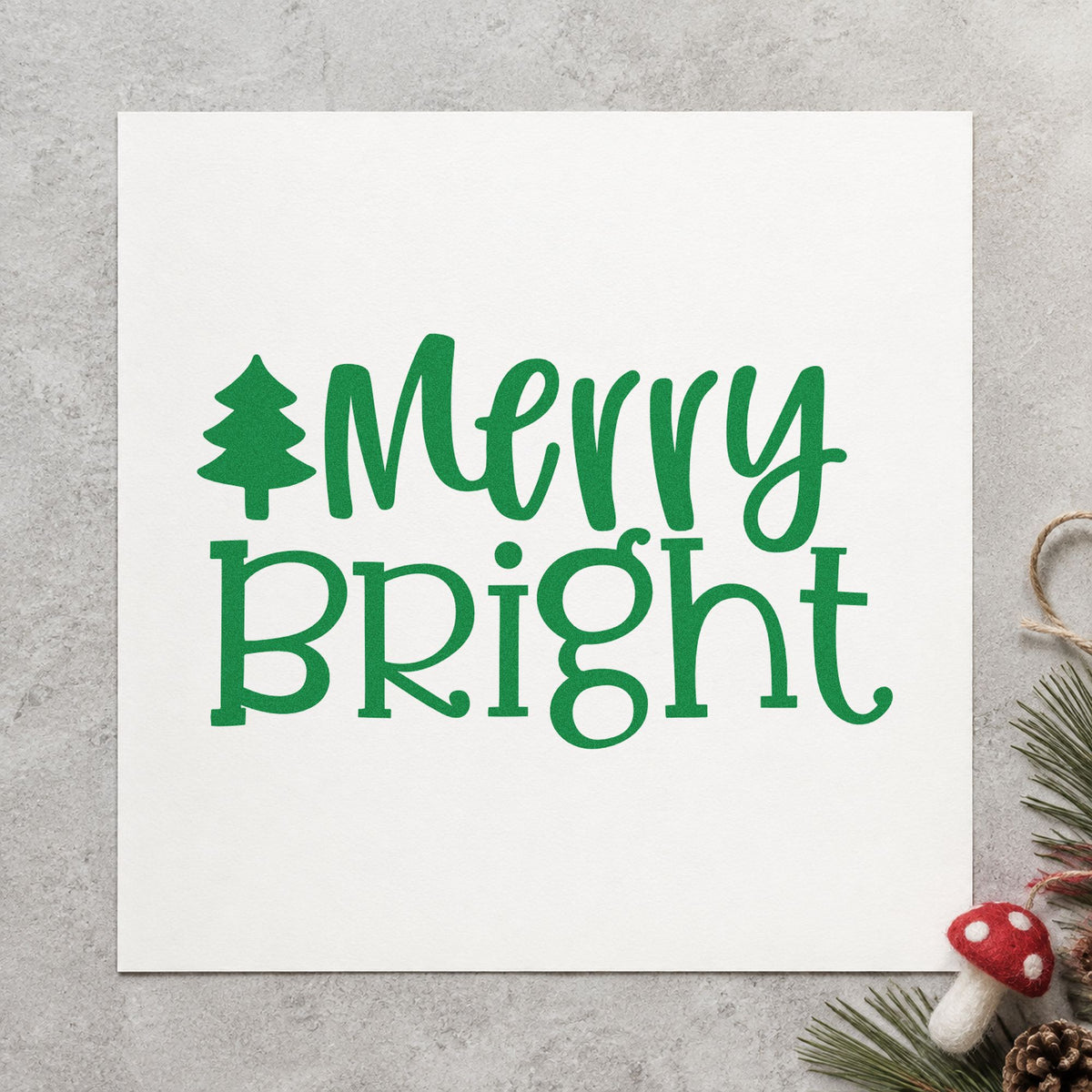 Merry Bright Christmas Tree craft stamp imprint in green ink on a handmade project, one idea being minimal gift tags.