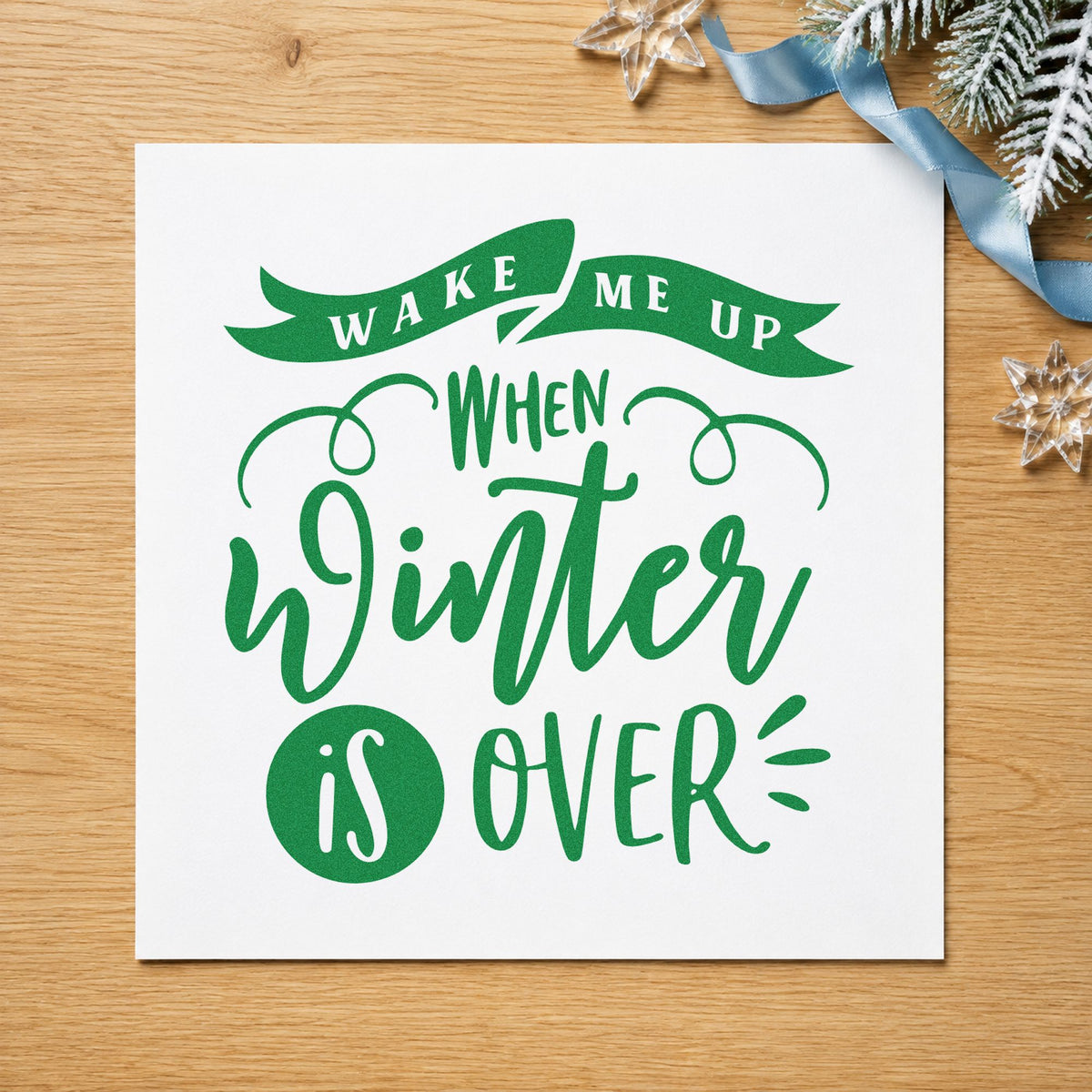 Wake Me When Winter Ends craft stamp imprint in green ink on a handmade project, one idea being sunscreen gift tags.