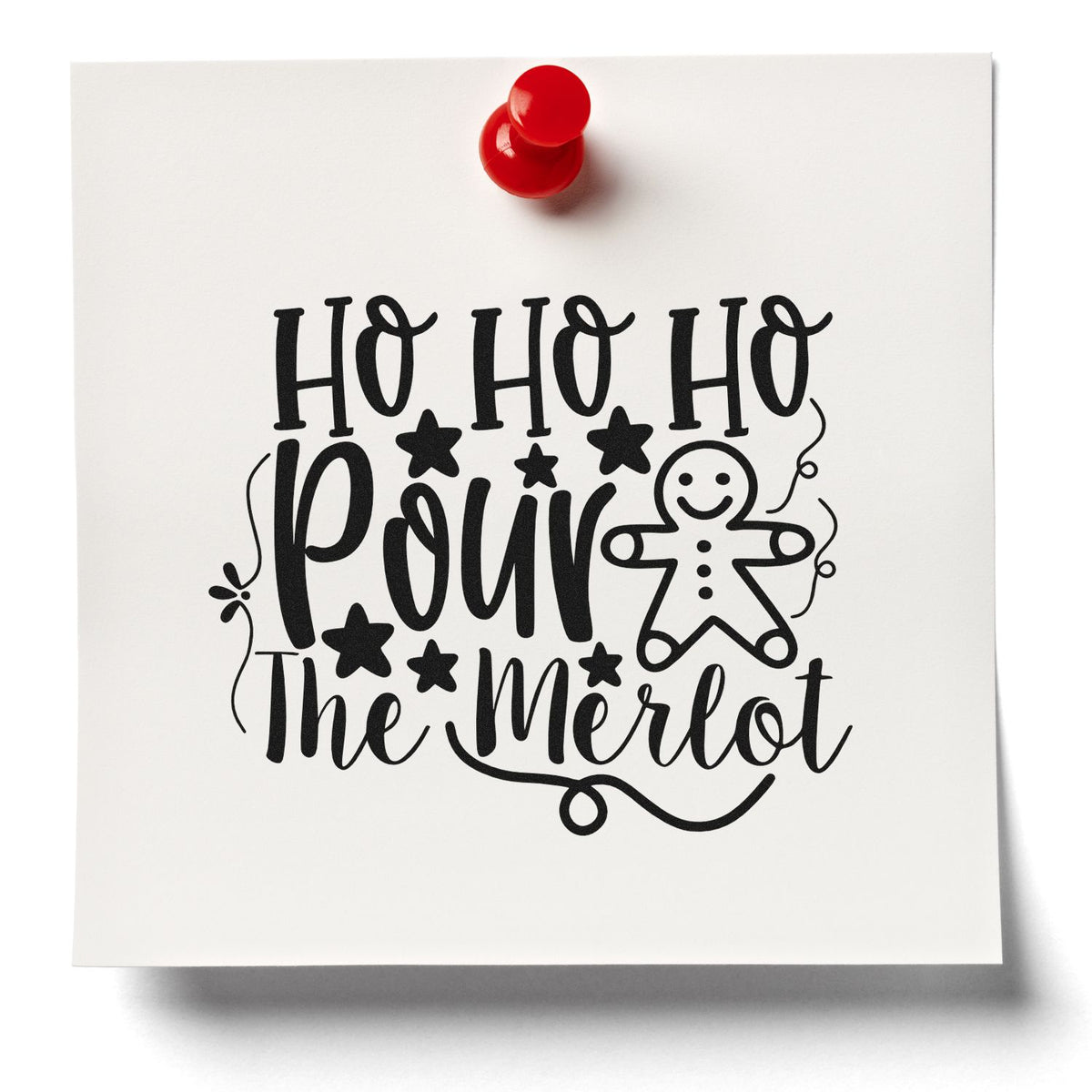 Black holiday stamp and seal on white card reading Ho Ho Ho Pour the Merlot, with gingerbread man, stars, and red push pin.