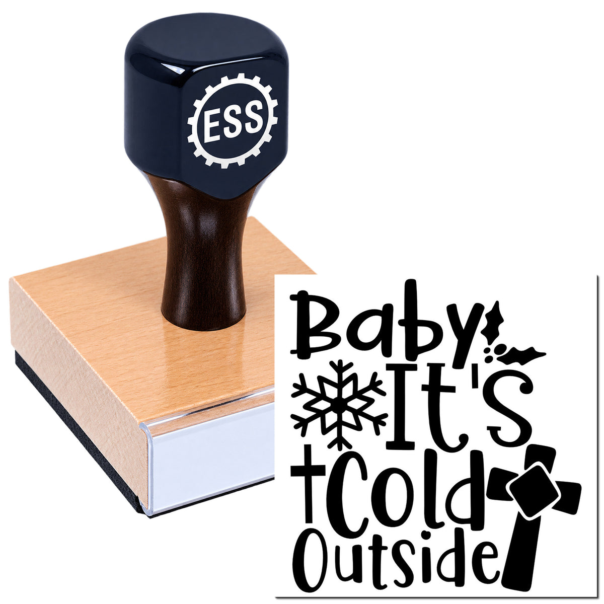 Dark navy ESS stamp and seal on a wood block, showing a black "Baby it's cold outside" winter design with snowflakes.