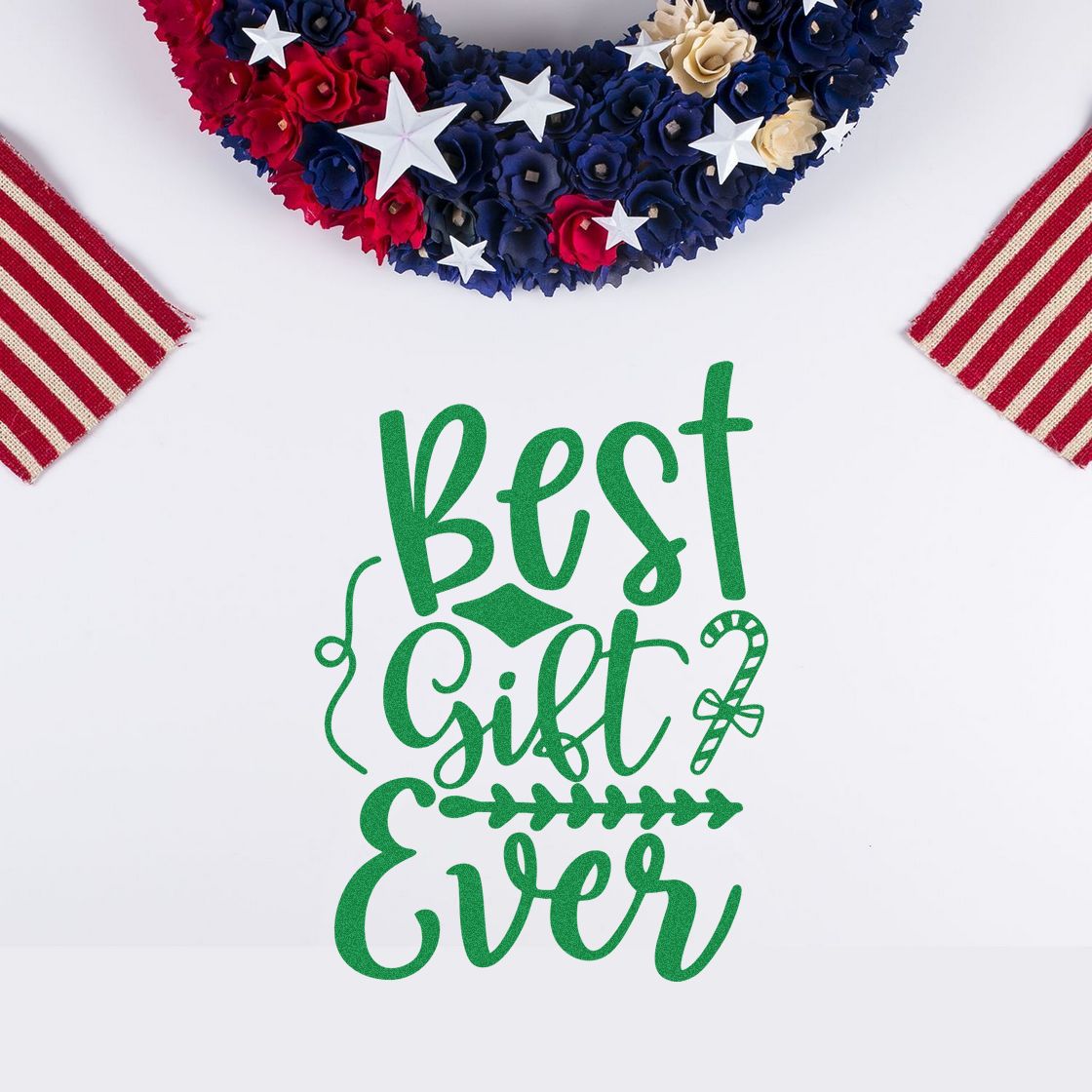 Green Best Gift Ever stamp and seal design on white, with patriotic blue, red, and cream floral wreath accents.