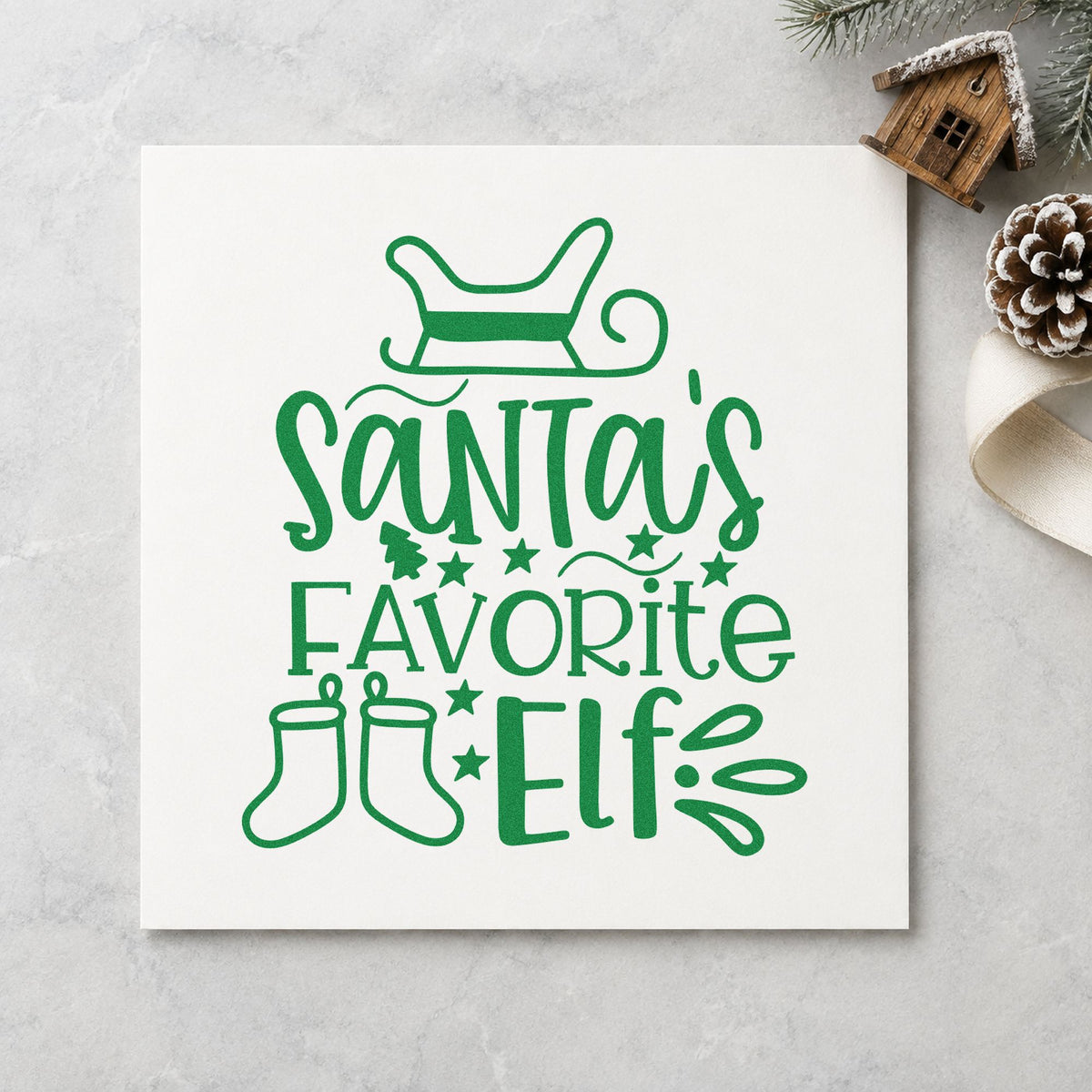 Santa's Favorite Elf Stockings craft stamp imprint in green ink on a handmade project, one idea being sibling order cards.