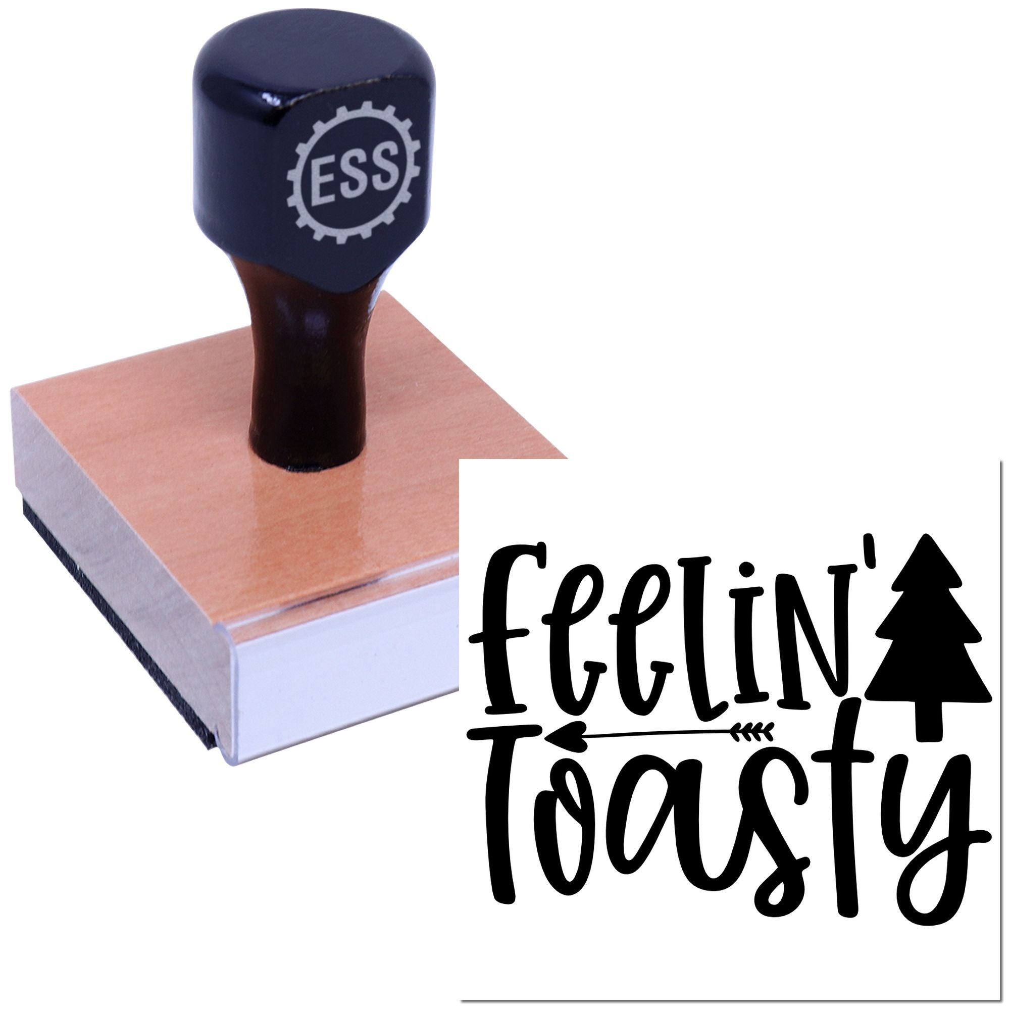 Dark blue ESS stamp on a wooden base, showing a black feelin toasty seal with pine tree and arrow design.