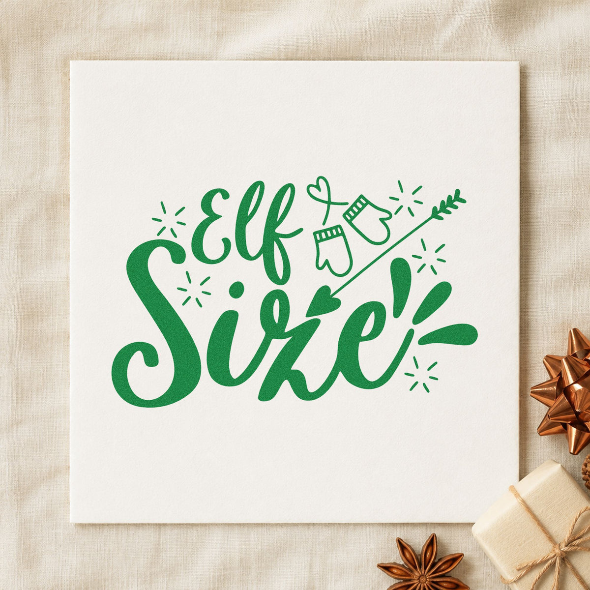 Elf Size Mittens Arrow craft stamp imprint in green ink on a handmade project, one idea being tiny size gift tags.