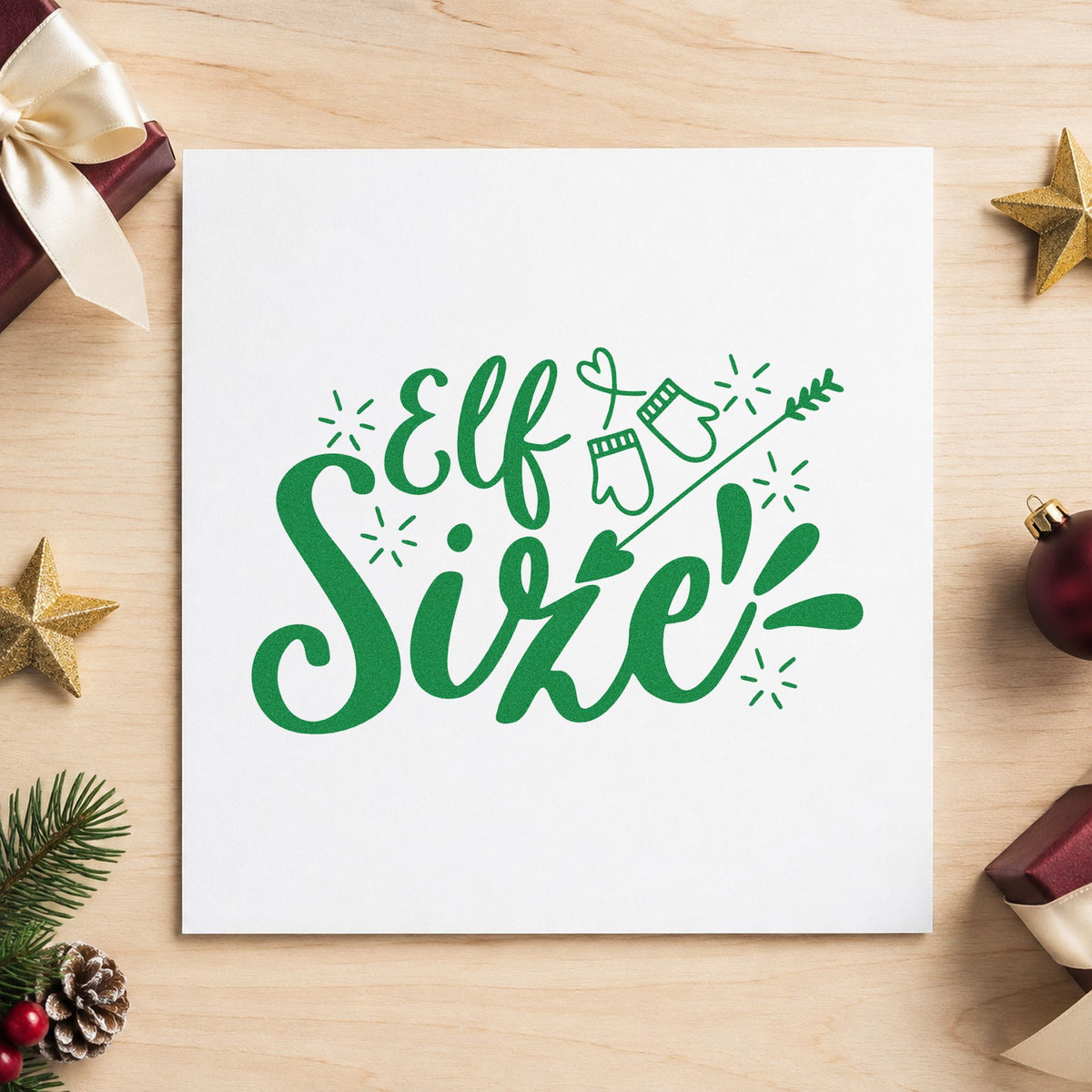 Elf Size Mittens Arrow craft stamp imprinted in green ink on paper, a design suited to framed nursery ledge.