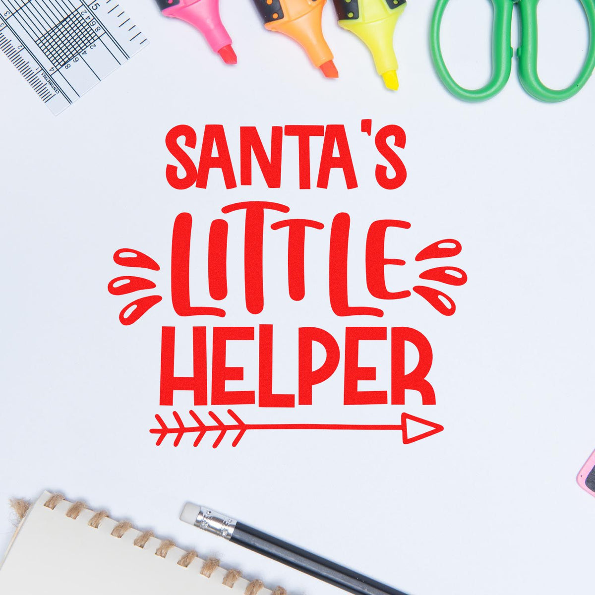 Red Santa's Little Helper stamp and seal design with arrow, surrounded by pink, orange and green craft tools.