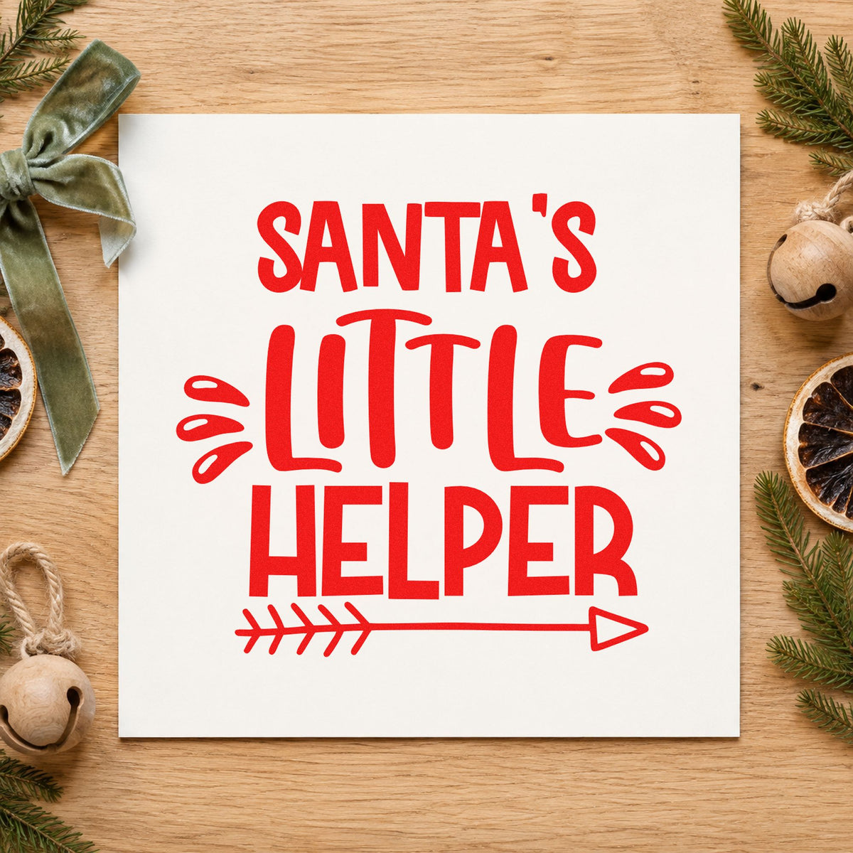 Santa's Little Helper Arrow rubber stamp shown in red ink, stamped for projects such as caddy slot labels.