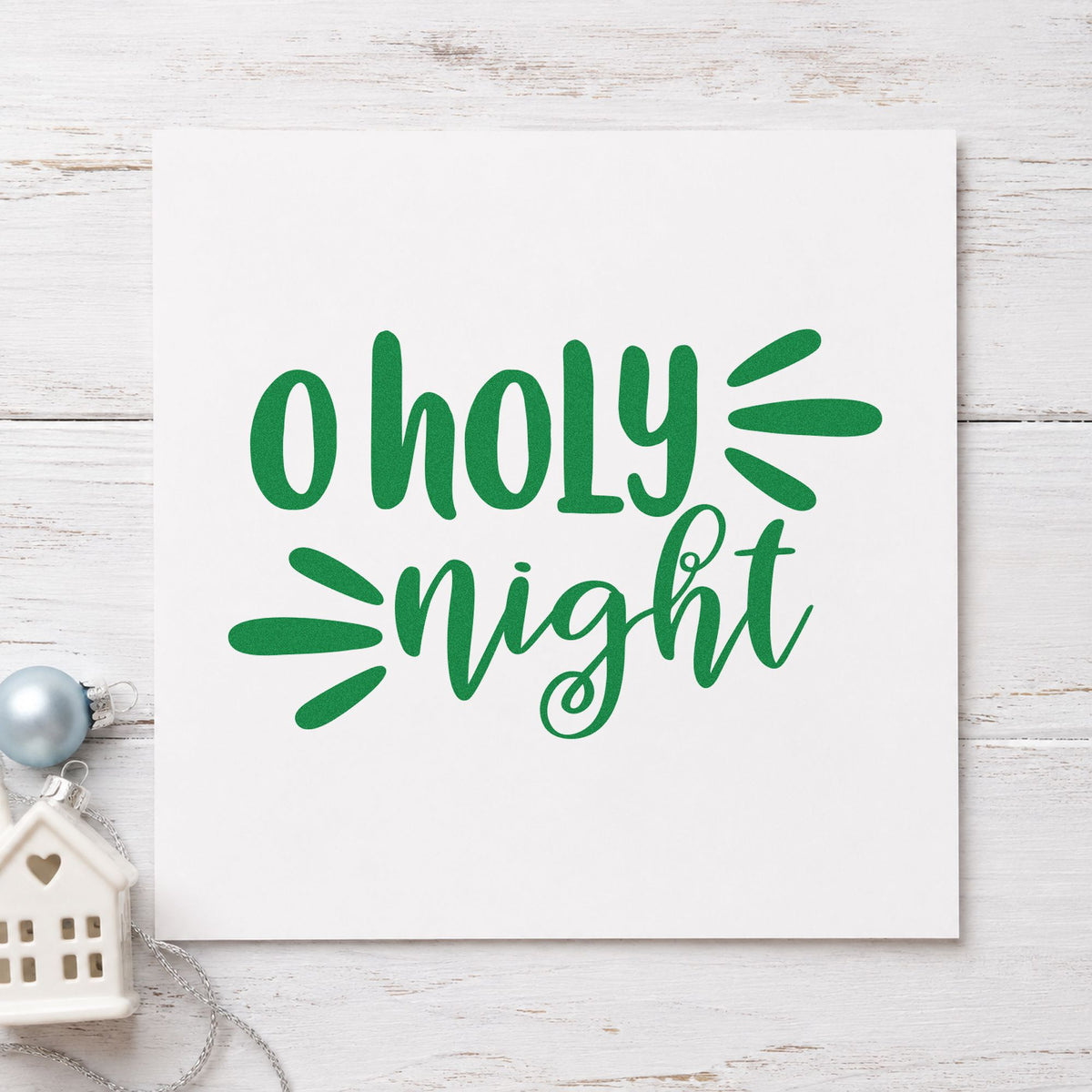 O Holy Night Script craft stamp imprint in green ink on a handmade project, one idea being bulletin clip tags.