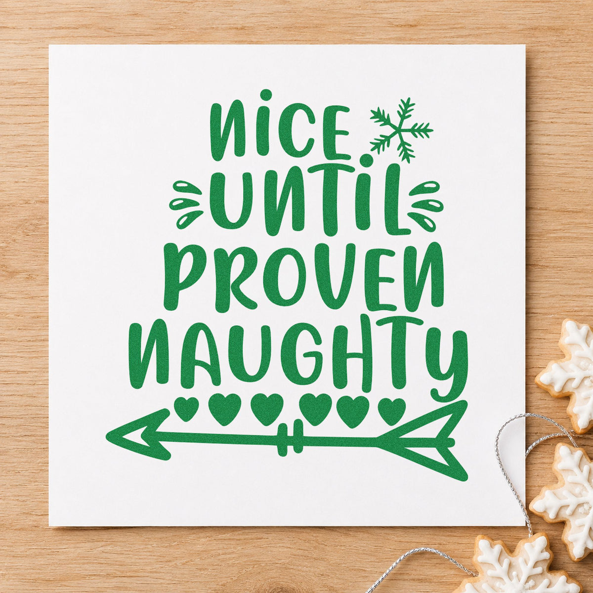 Nice Until Proven Naughty craft stamp imprint in green ink on a handmade project, one idea being exhibit number tags.