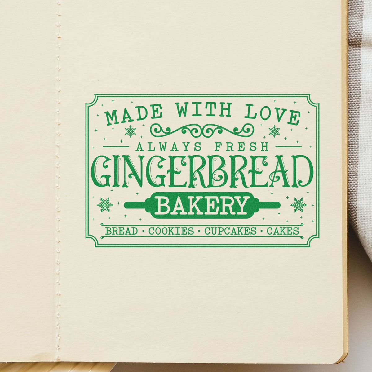 Green decorative gingerbread bakery stamp and seal on cream paper, reading Made with Love, Always Fresh, Bread, Cookies, Cupcakes, Cakes.