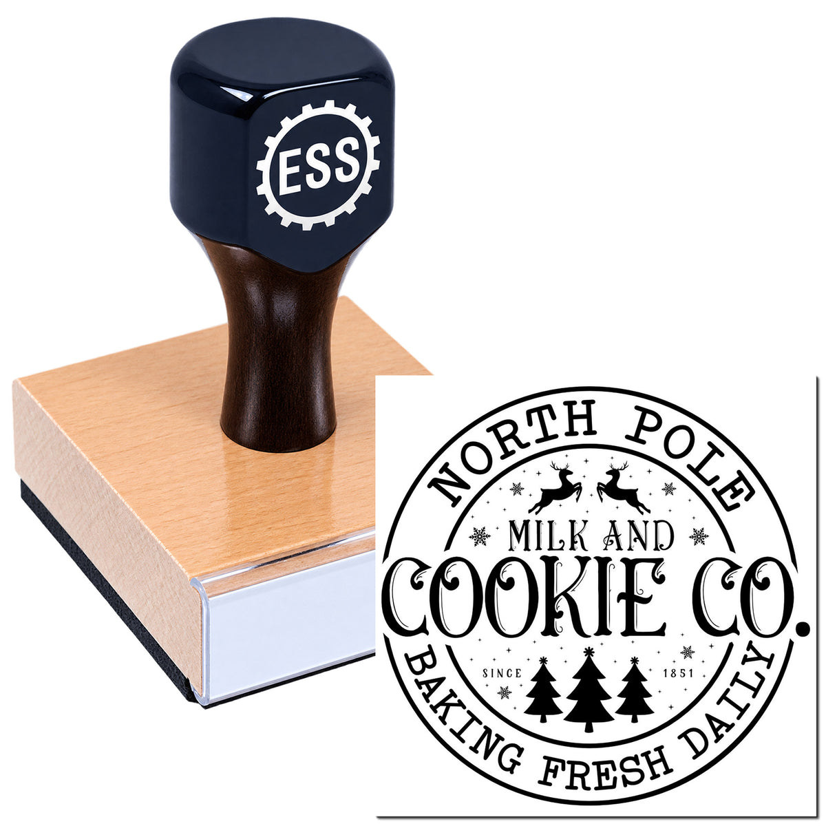 Black ESS rubber stamp on pink wooden block beside circular black seal for North Pole Cookie Co., baking fresh daily.