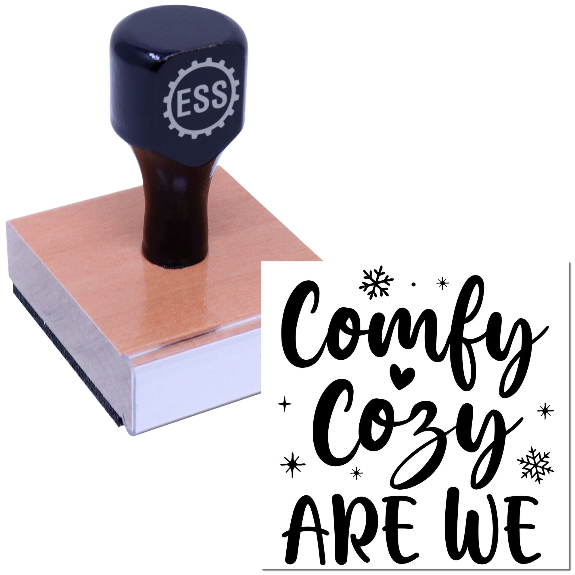 Navy ESS rubber stamp on wood block with black Comfy Cozy seal design, snowflakes, and heart accents