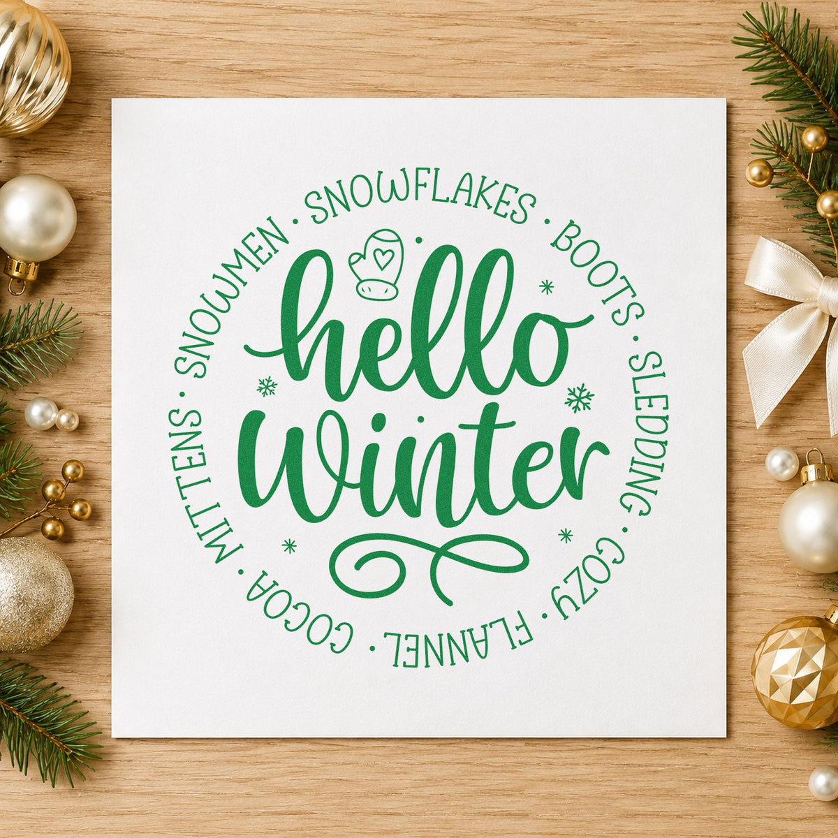 Hello Winter Circular Words craft stamp imprint in green ink on a handmade project, one idea being table round cards.