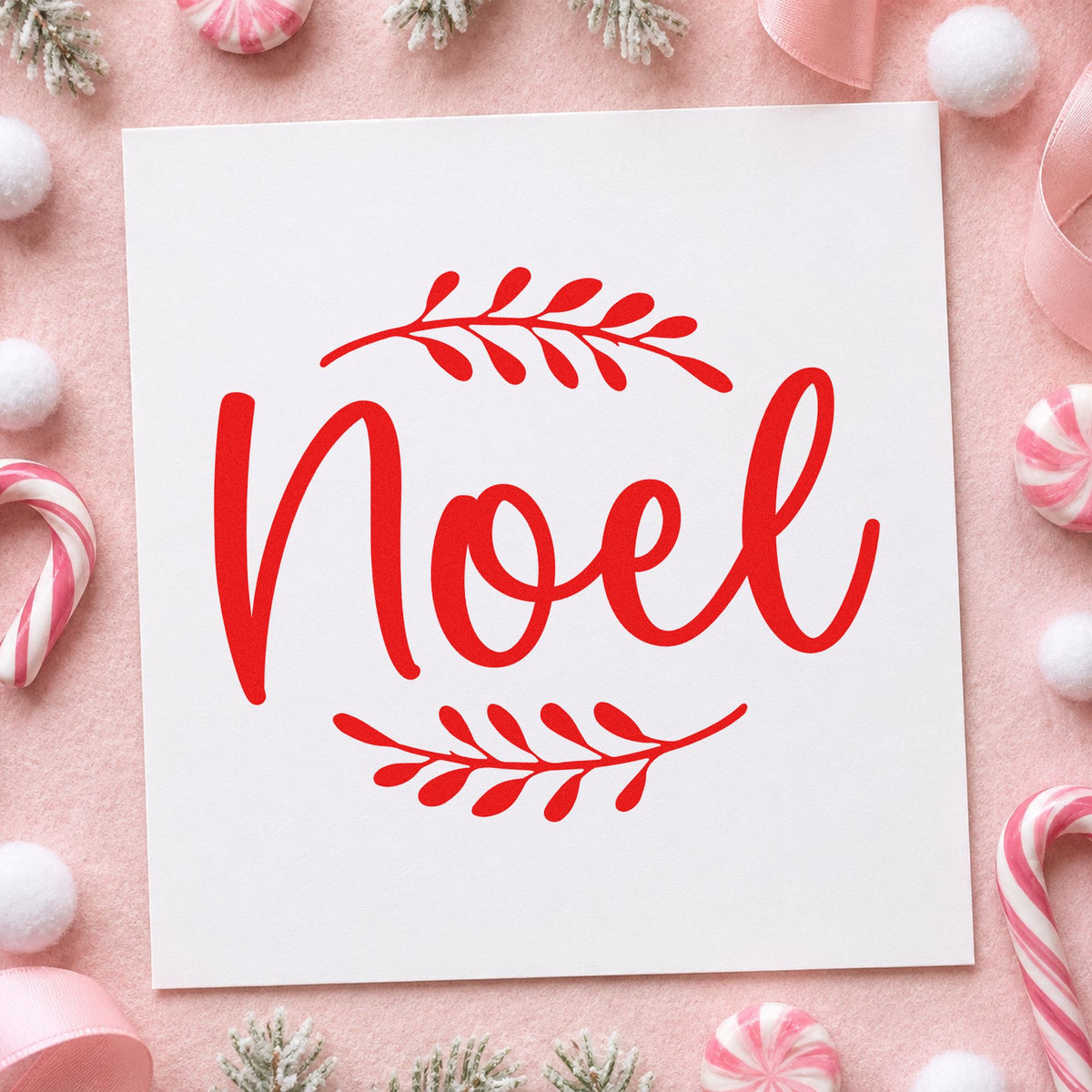 Noel With Leafy Sprigs craft stamp in red ink on cardstock, an easy option for pillow front printing.