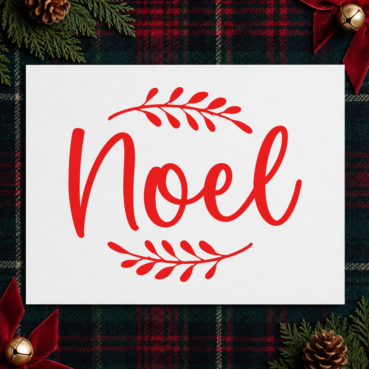 Noel With Leafy Sprigs rubber stamp shown in red ink, stamped for projects such as candle sleeve labels.