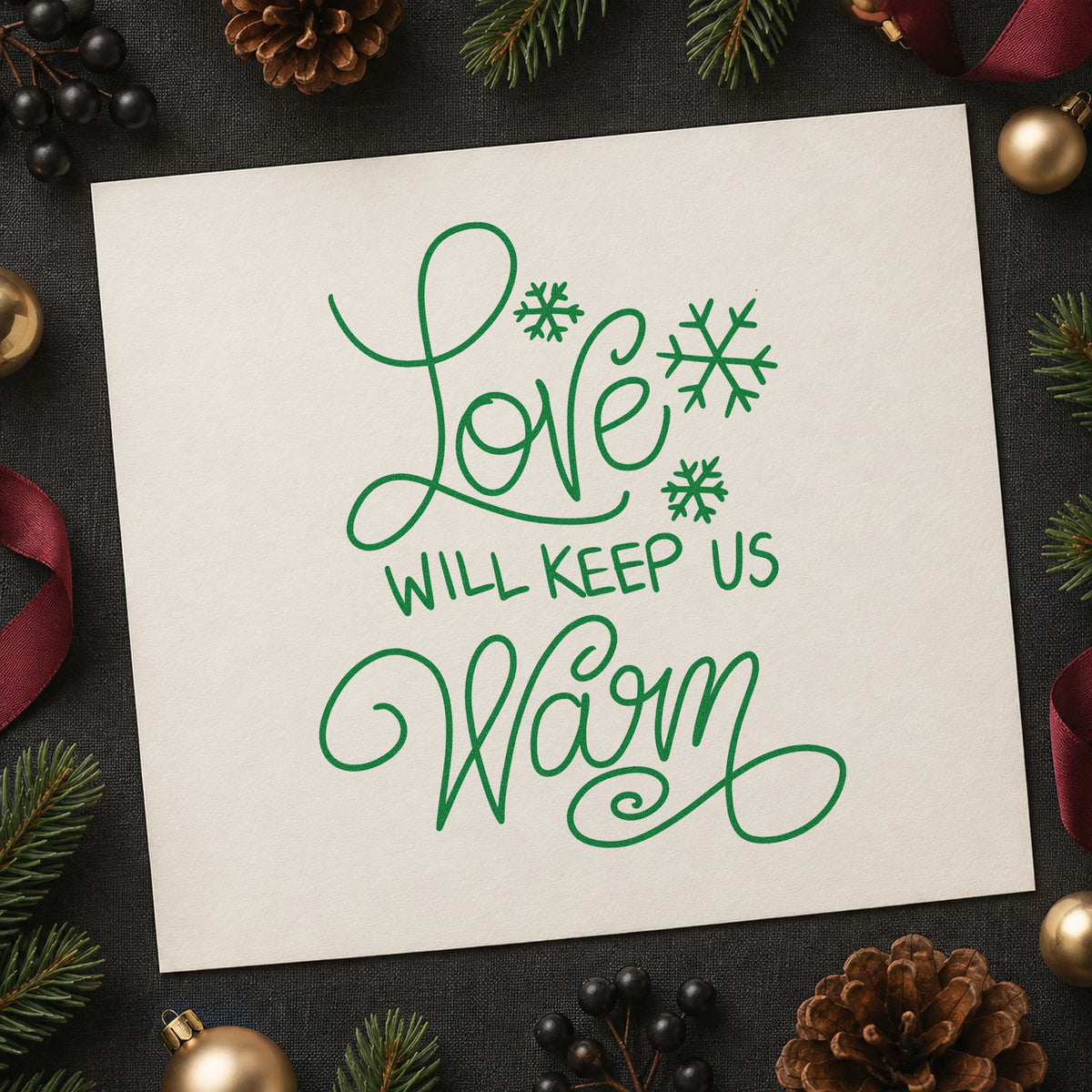 Love Will Keep Us Warm craft stamp imprint in green ink on a handmade project, one idea being wool blanket tags.