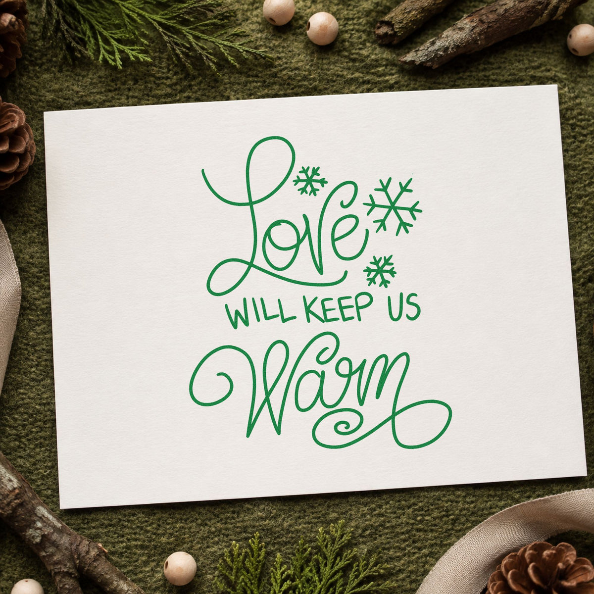 Love Will Keep Us Warm craft stamp imprinted in green ink on paper, a design suited to framed bedside pair.