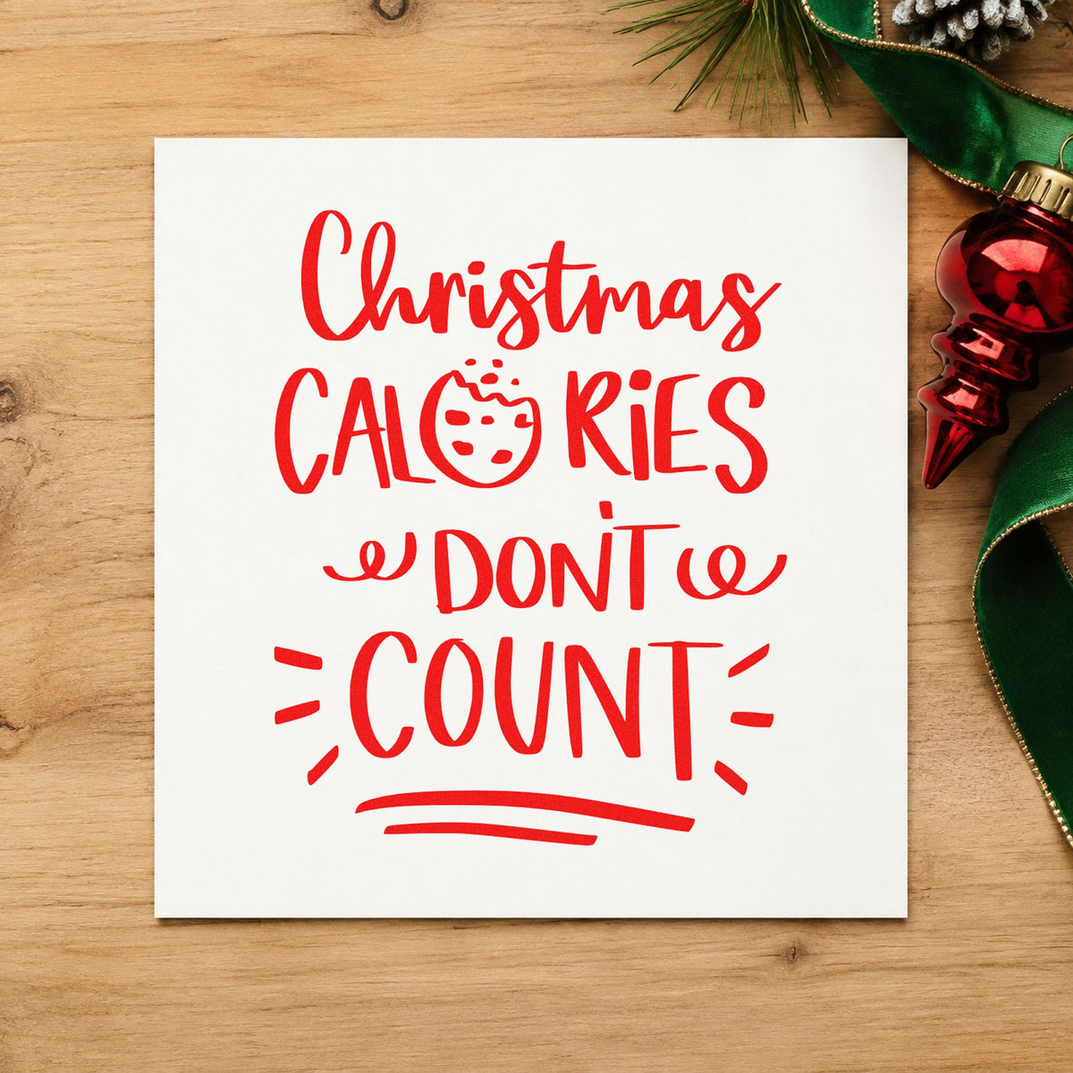 Christmas Calories Don't Count craft stamp in red ink on cardstock, an easy option for case cloth printing.
