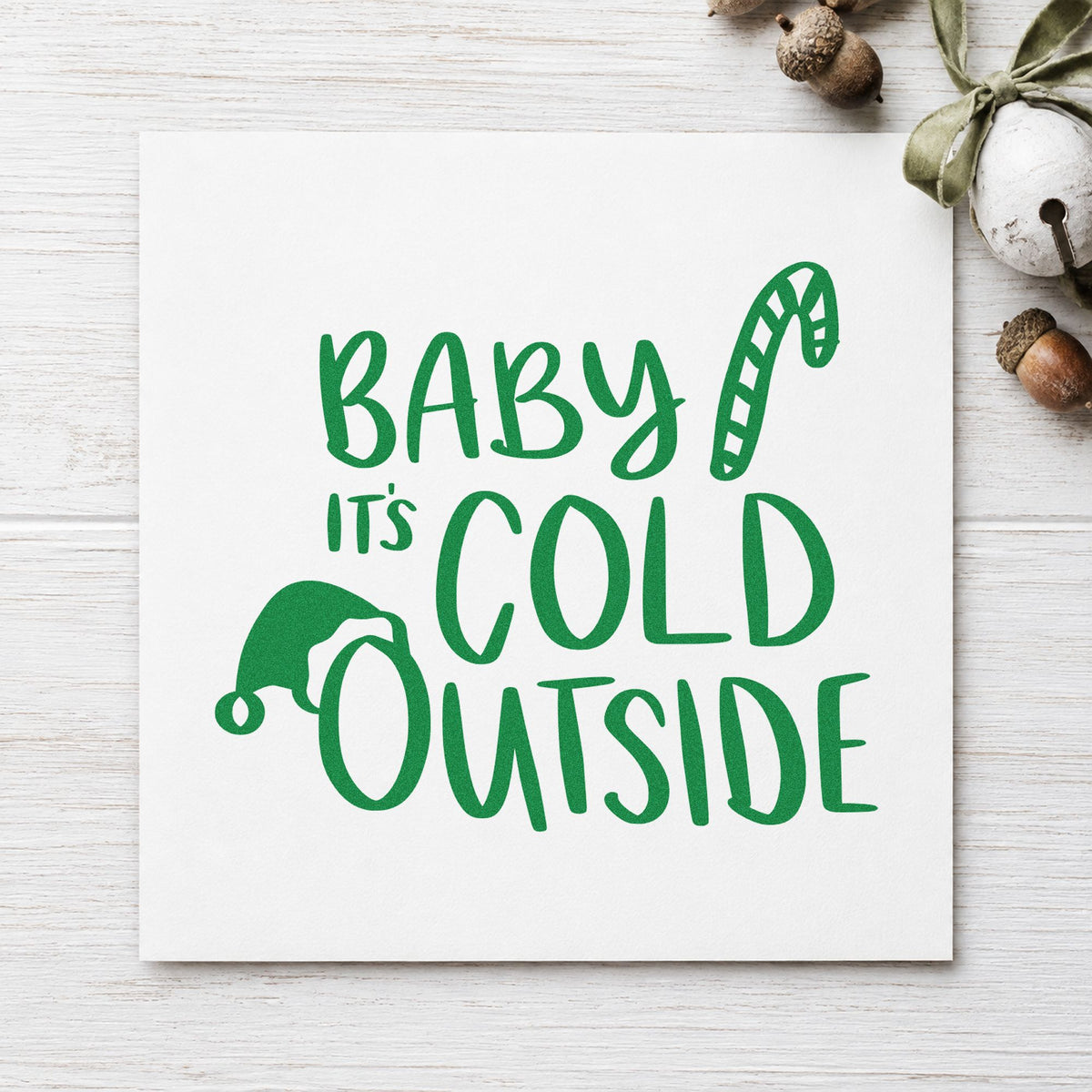 Baby It's Cold Outside Hat craft stamp imprint in green ink on a handmade project, one idea being cocoa cup gift tags.