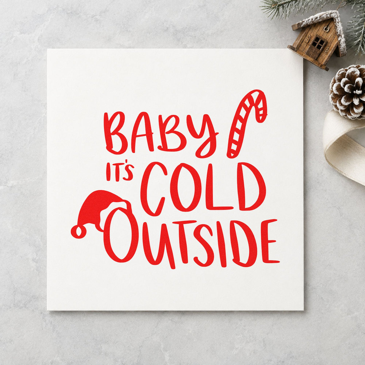 Baby It's Cold Outside Hat craft stamp in red ink on cardstock, an easy option for snowsuit patch ink.