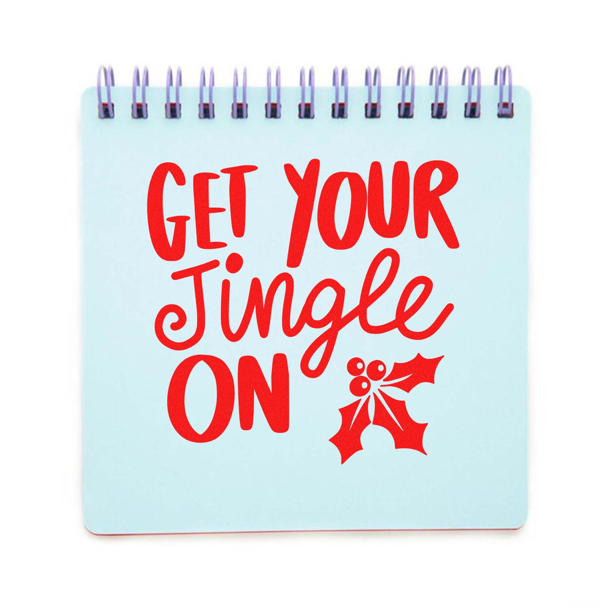 Light blue spiral-bound holiday stamp and seal with bold red Get Your Jingle On text and holly graphic.