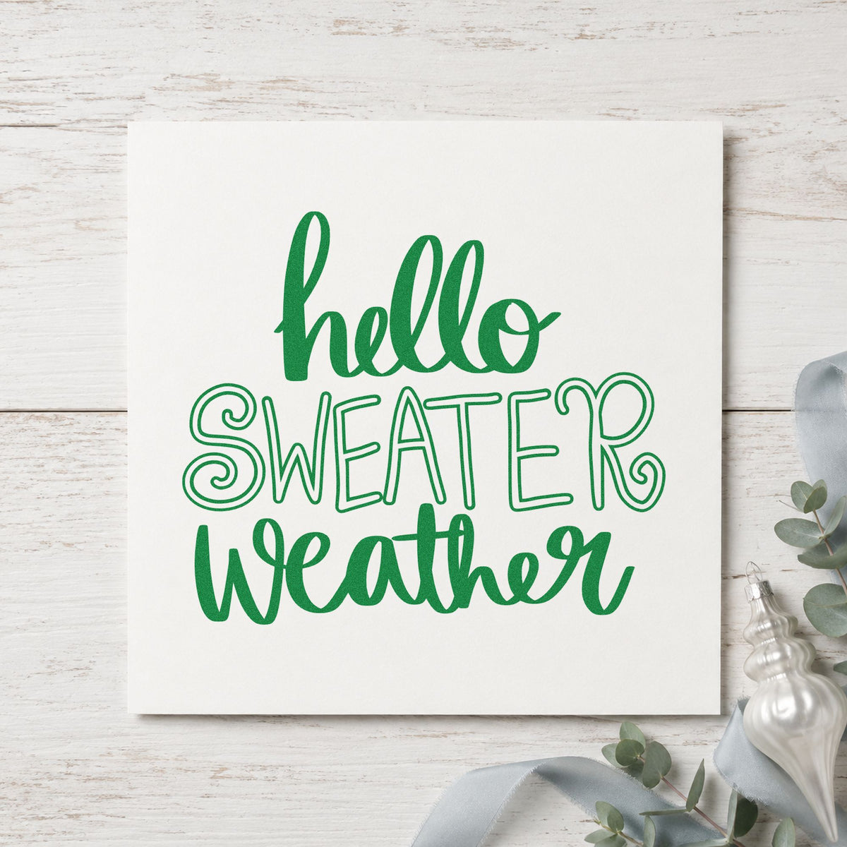 Hello Sweater Weather Lettering craft stamp imprinted in green ink on paper, a design suited to framed line print.