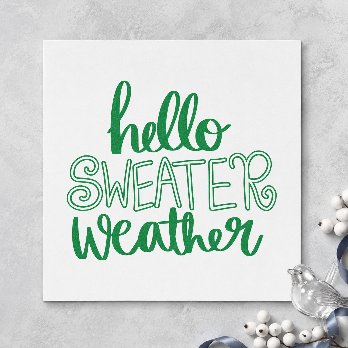 Hello Sweater Weather Lettering craft stamp imprint in green ink on a handmade project, one idea being coloring page cards.