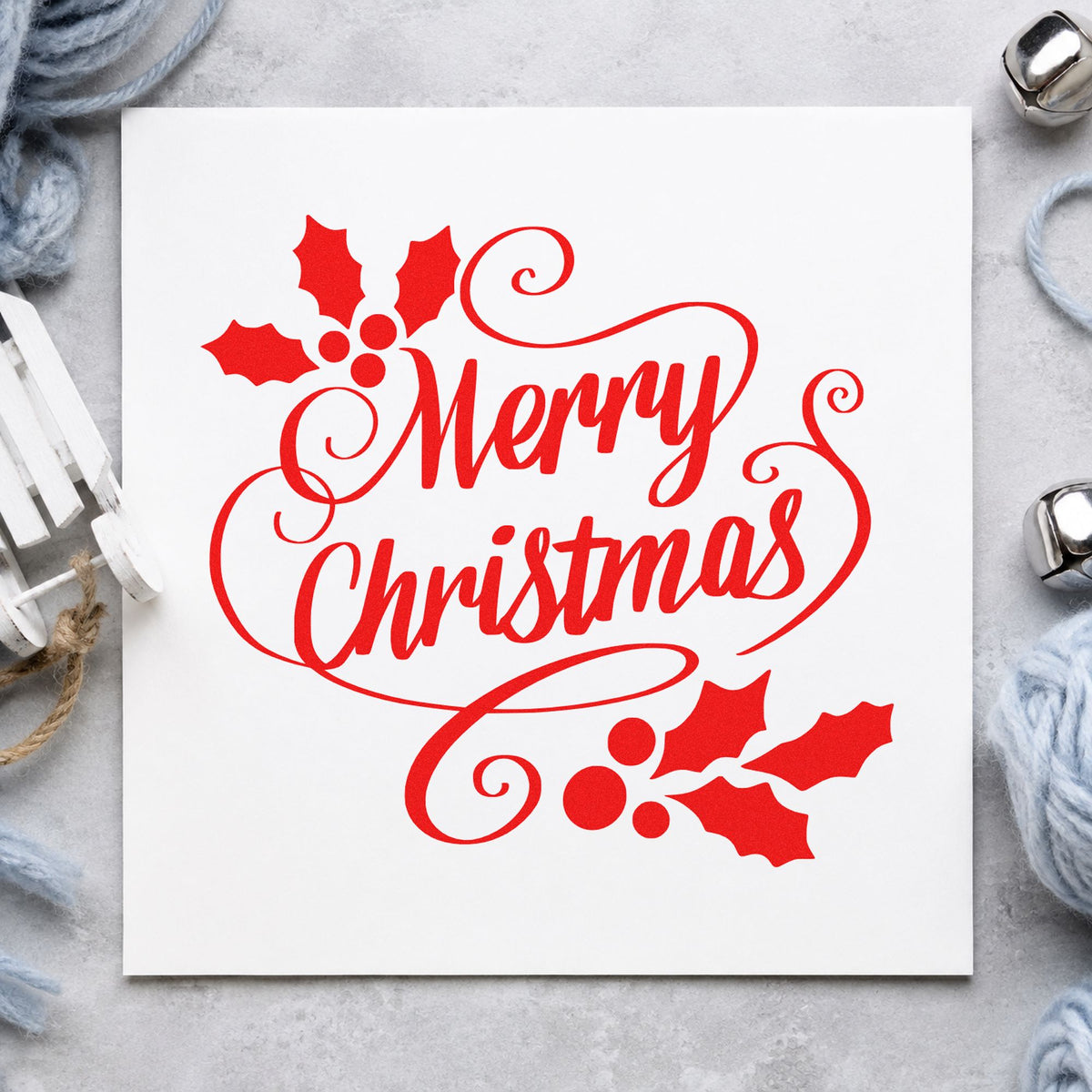 Merry Christmas Holly Flourishes craft stamp in red ink on cardstock, an easy option for sash trim printing.