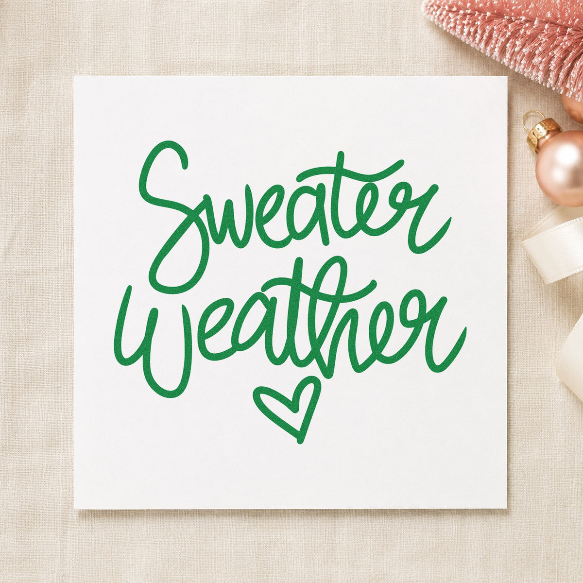 Sweater Weather Little Heart craft stamp imprinted in green ink on paper, a design suited to framed closet shelf.
