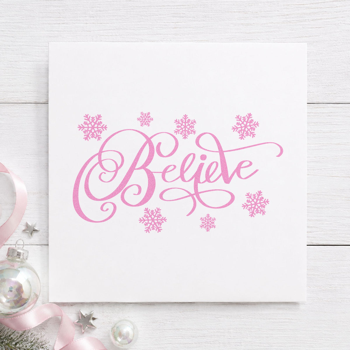 Believe Surrounded By Snowflakes craft stamp in purple ink on cardstock, an easy option for paper cut album.