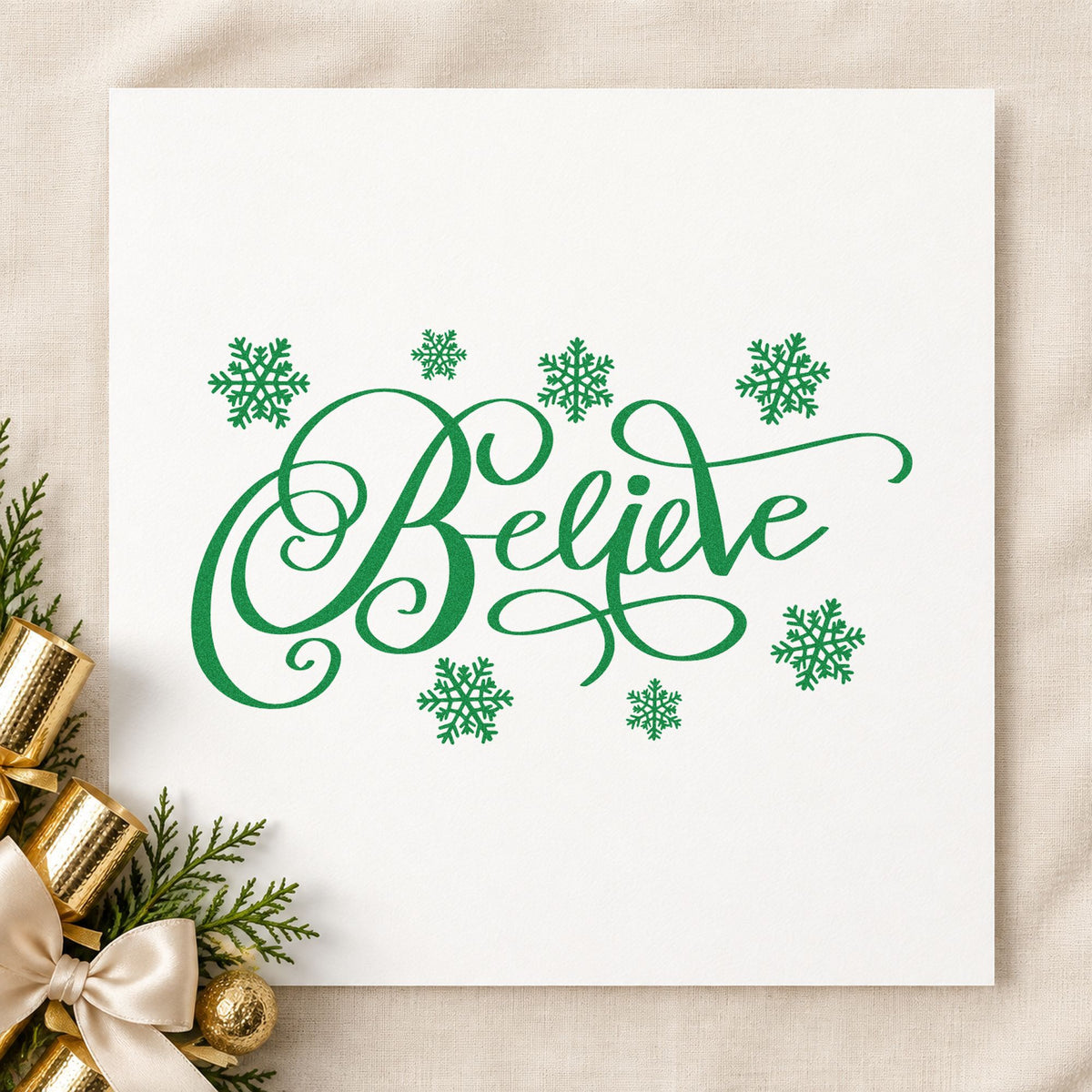 Believe Surrounded By Snowflakes craft stamp imprint in green ink on a handmade project, one idea being flake craft tags.