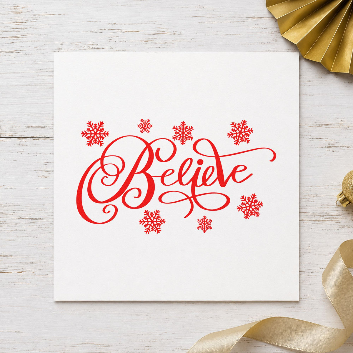 Believe Surrounded By Snowflakes rubber stamp shown in red ink, stamped for projects such as glitter bin labels.