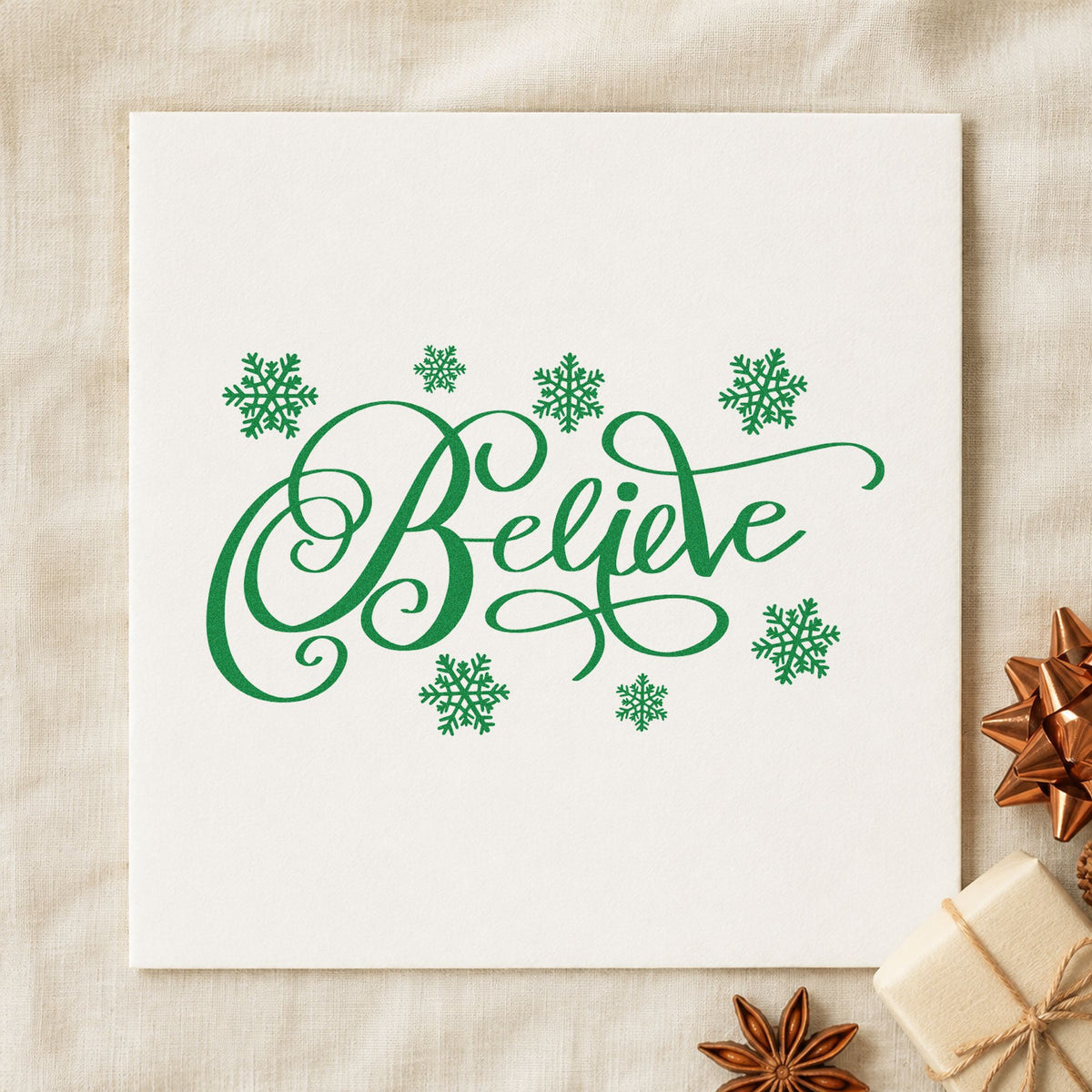 Believe Surrounded By Snowflakes craft stamp imprint in green ink on a handmade project, one idea being craft class cards.