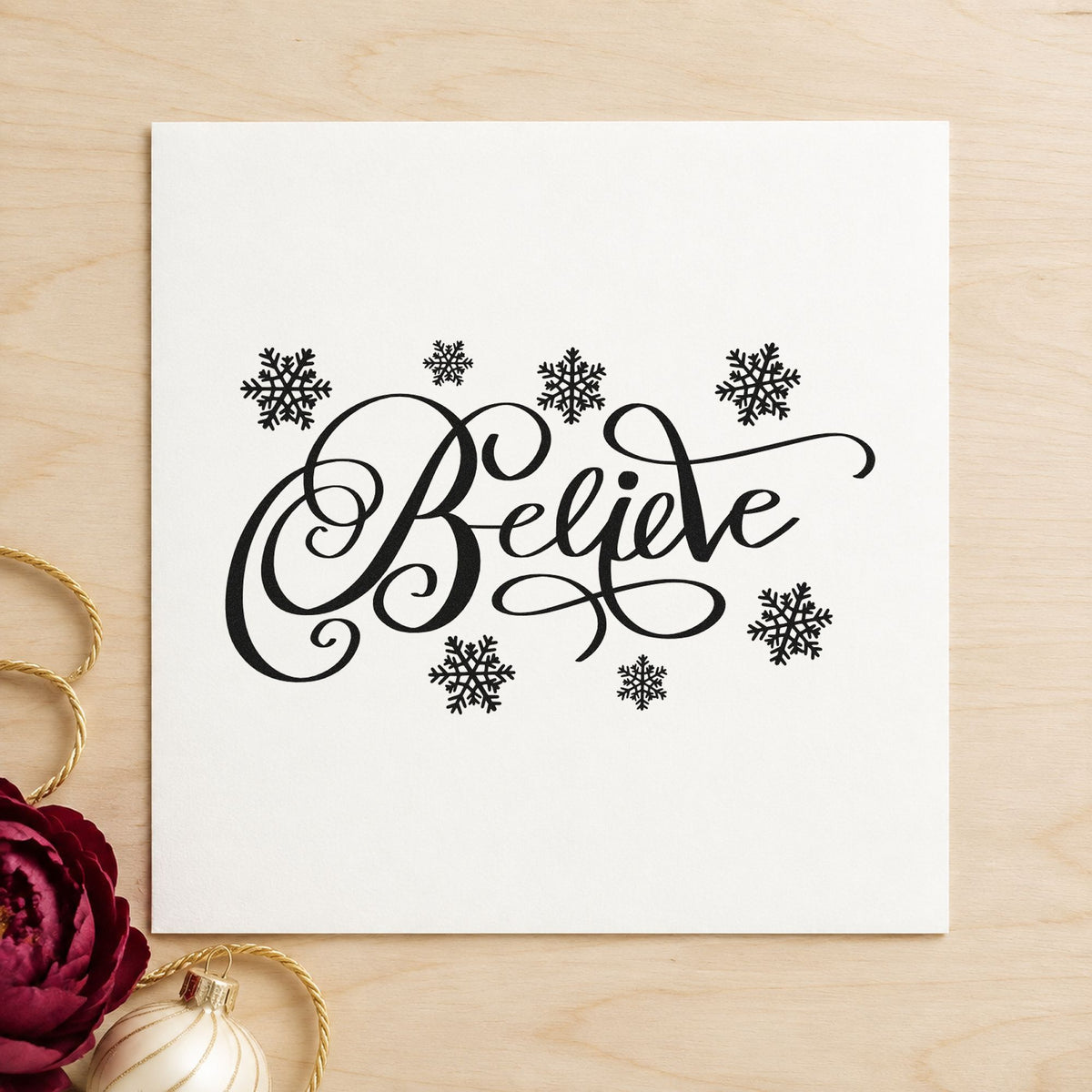 Believe Surrounded By Snowflakes rubber stamp printed in black ink, ready for flakes around cards and similar paper crafts.
