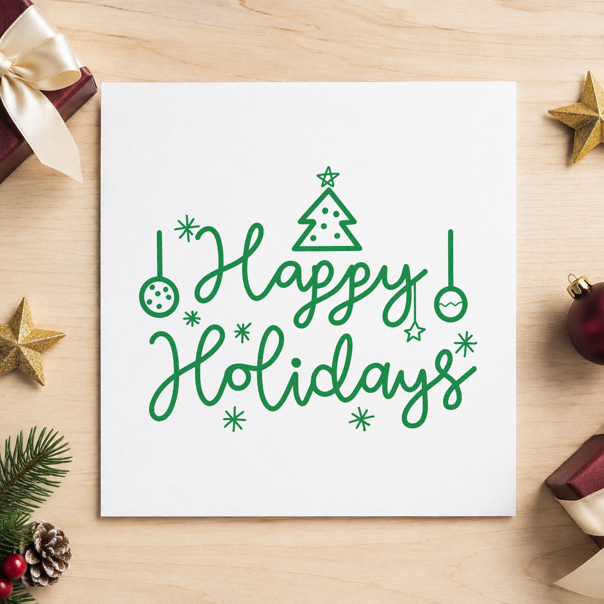 Happy Holidays Tree Ornaments craft stamp imprint in green ink on a handmade project, one idea being ornament hook tags.