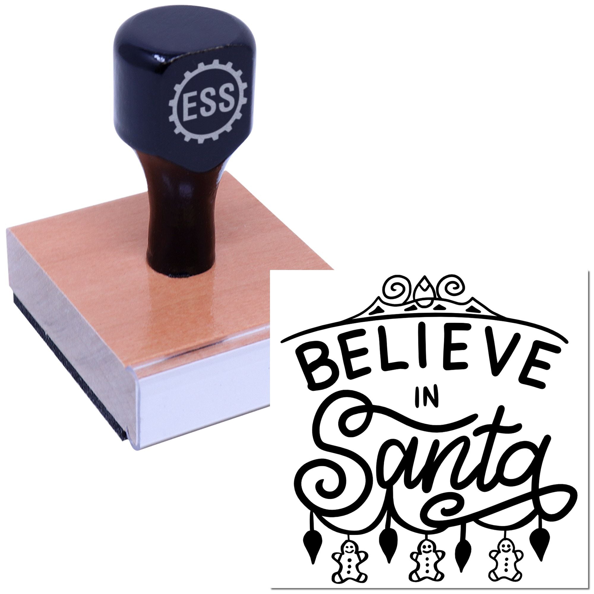 Dark navy ESS stamp on a wooden handle with pink base beside a black Believe in Santa holiday seal.