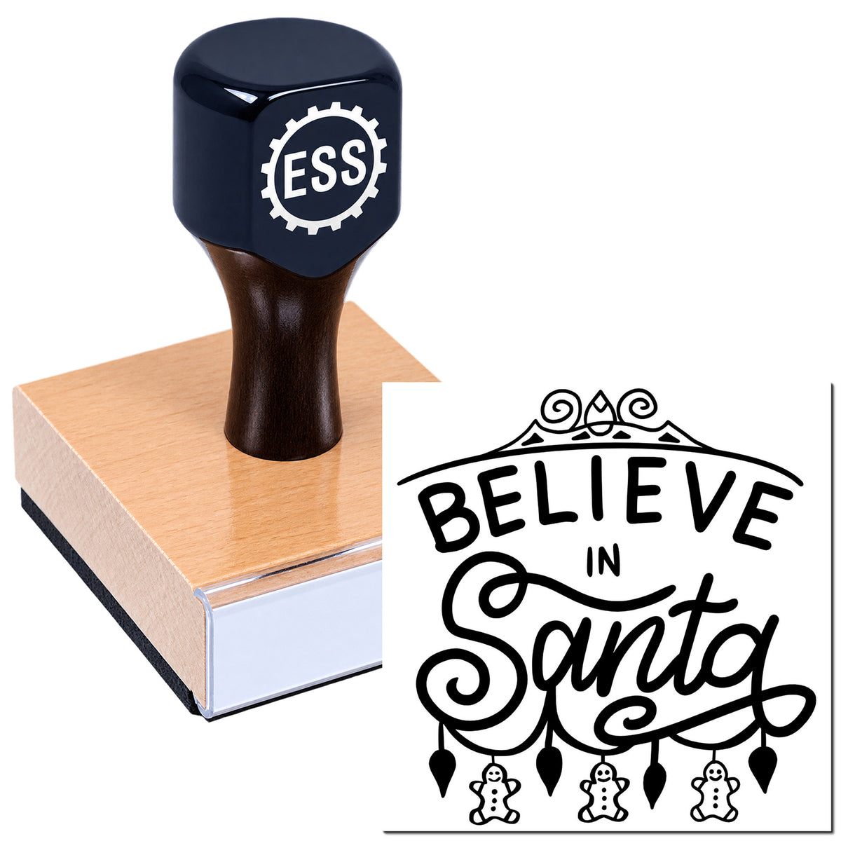 Dark navy ESS stamp on a wooden handle with pink base beside a black "Believe in Santa" holiday seal.