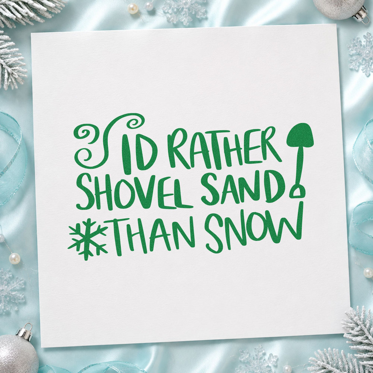 Rather Shovel Sand Than Snow craft stamp imprint in green ink on a handmade project, one idea being travel kit gift tags.