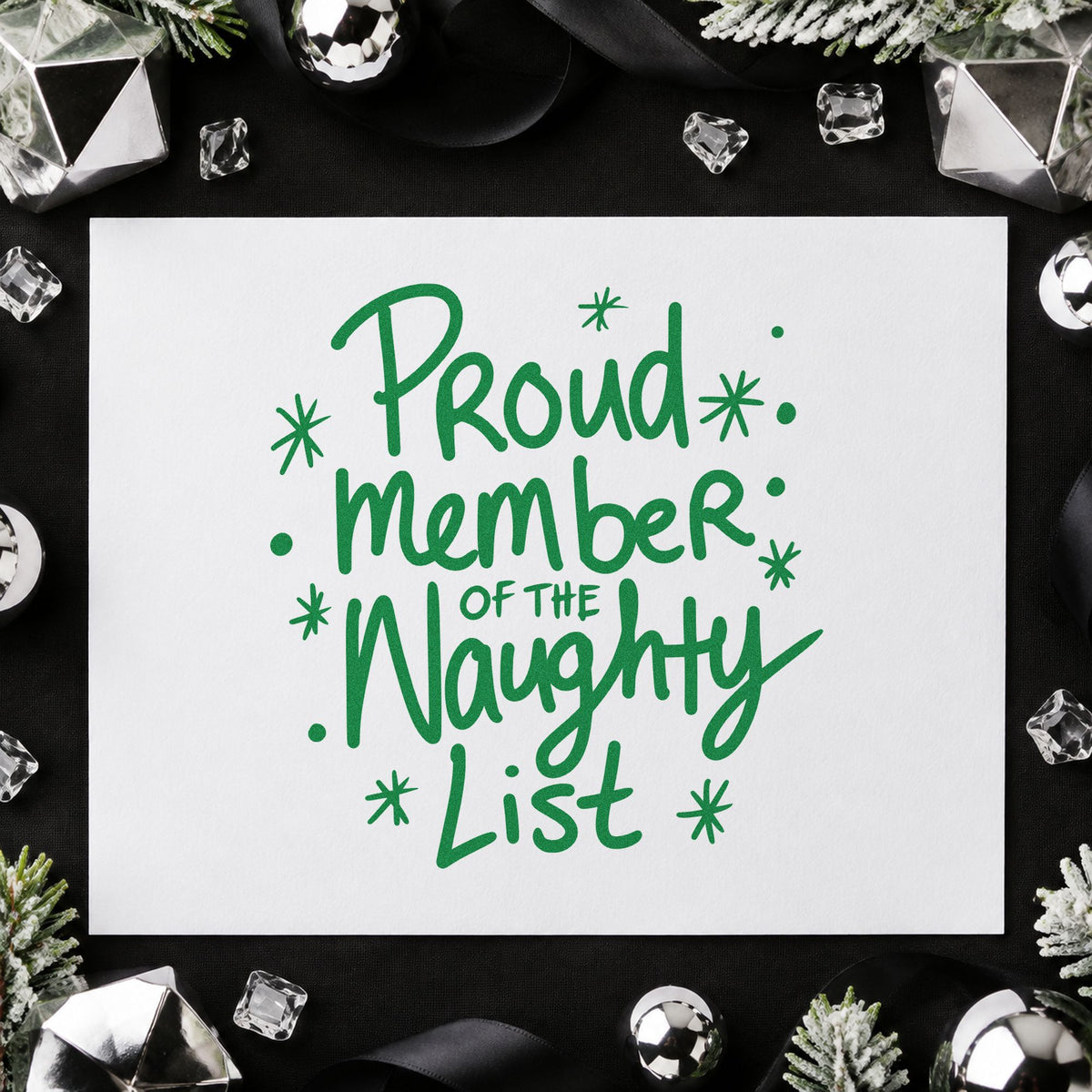 Proud Naughty List Member craft stamp imprint in green ink on a handmade project, one idea being joining card tags.