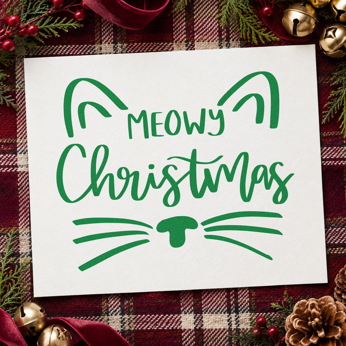 Meowy Christmas Cat Face craft stamp imprinted in green ink on paper, a design suited to framed window perch.